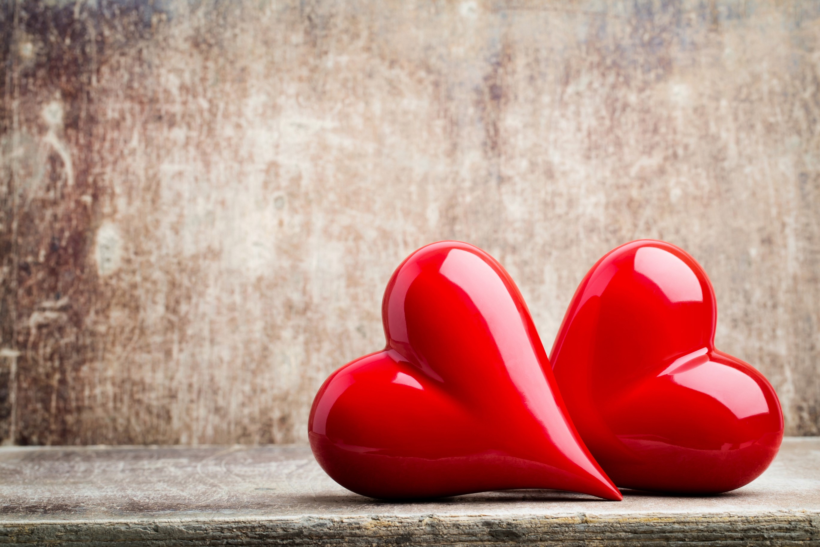 Two red hearts on a wooden surface HD Wallpaper