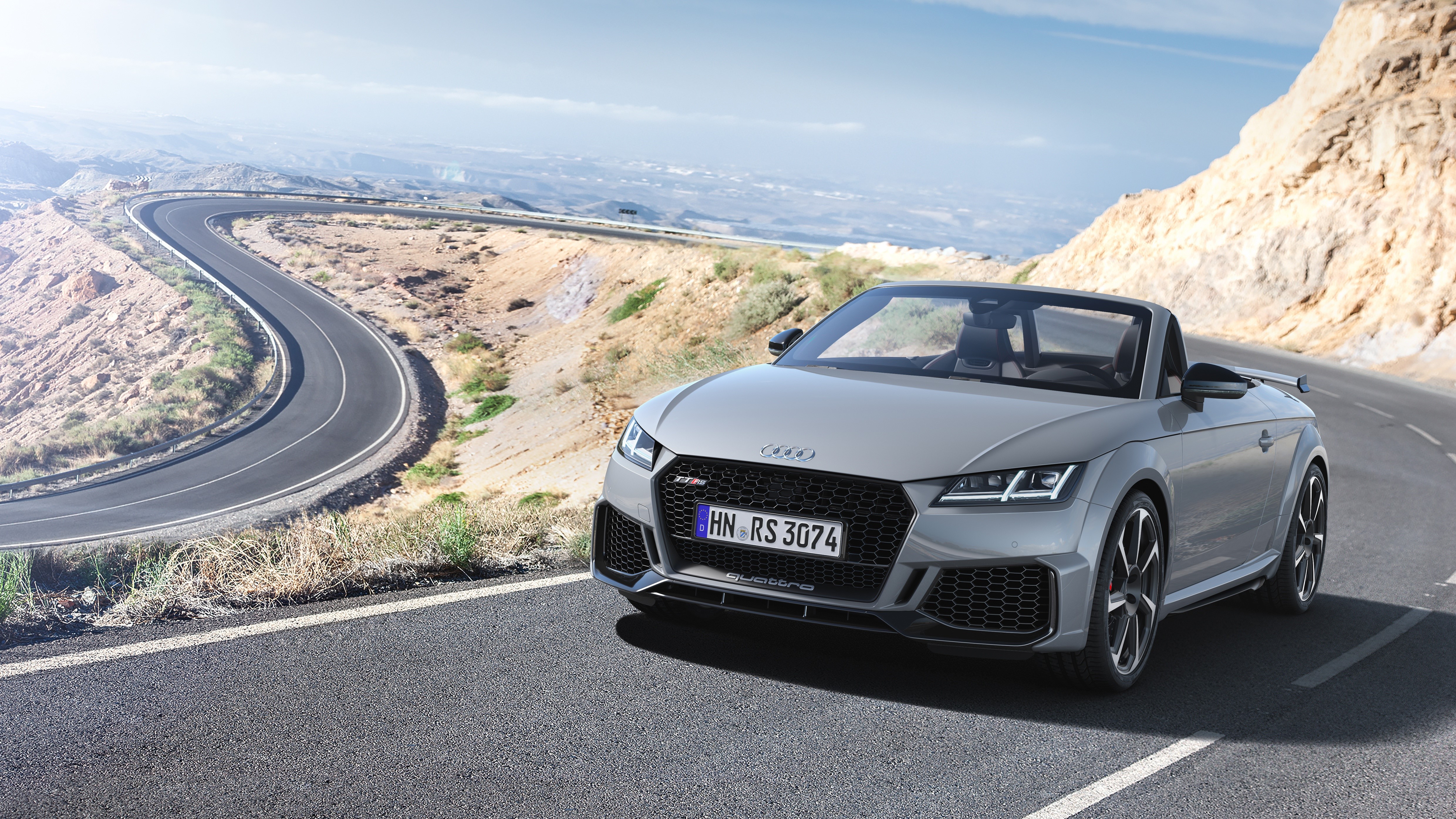 Audi TT RS 2020 Roadster on a winding mountain road HD Wallpaper