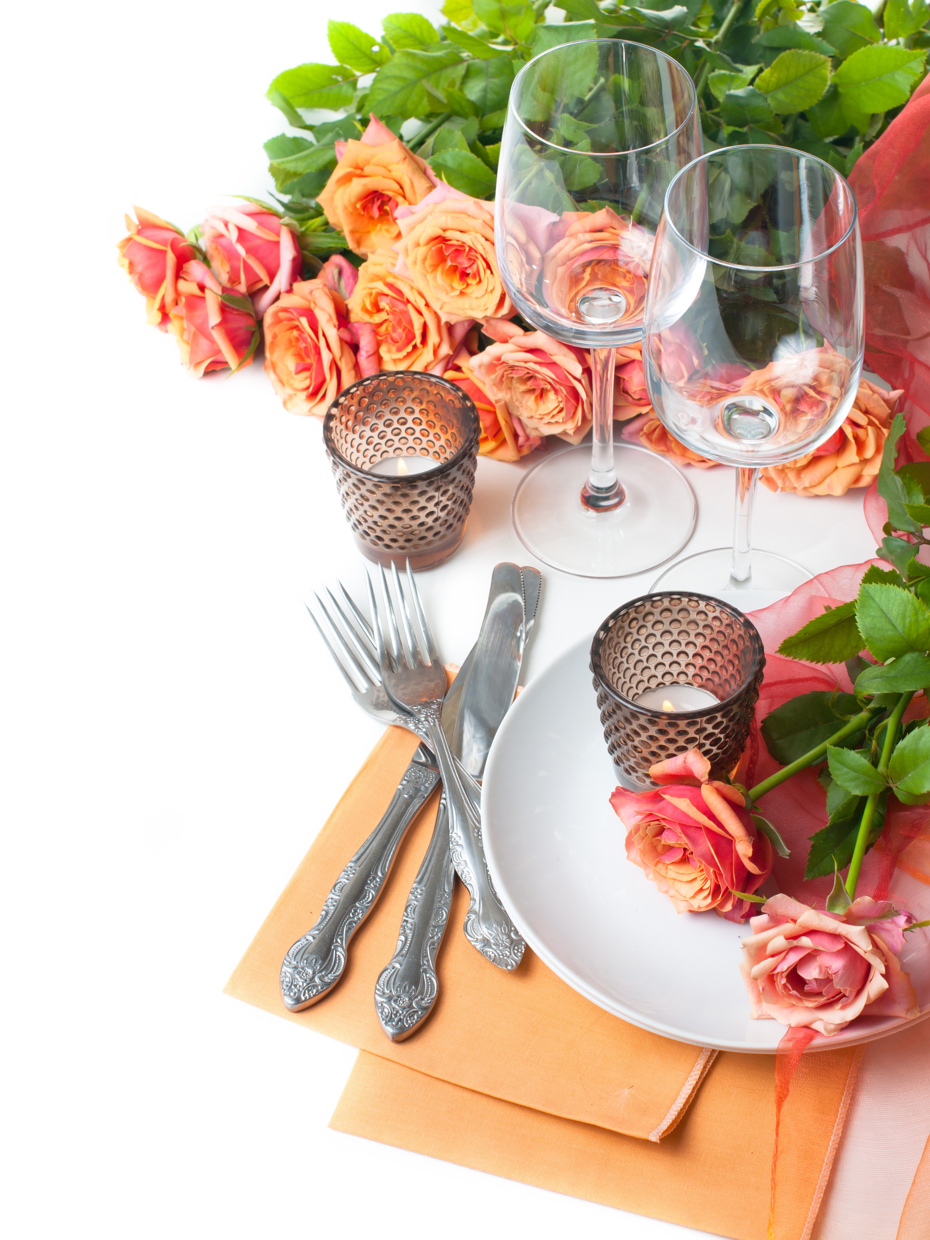 Table setting with roses, wine glasses, and candles HD Phone Wallpaper