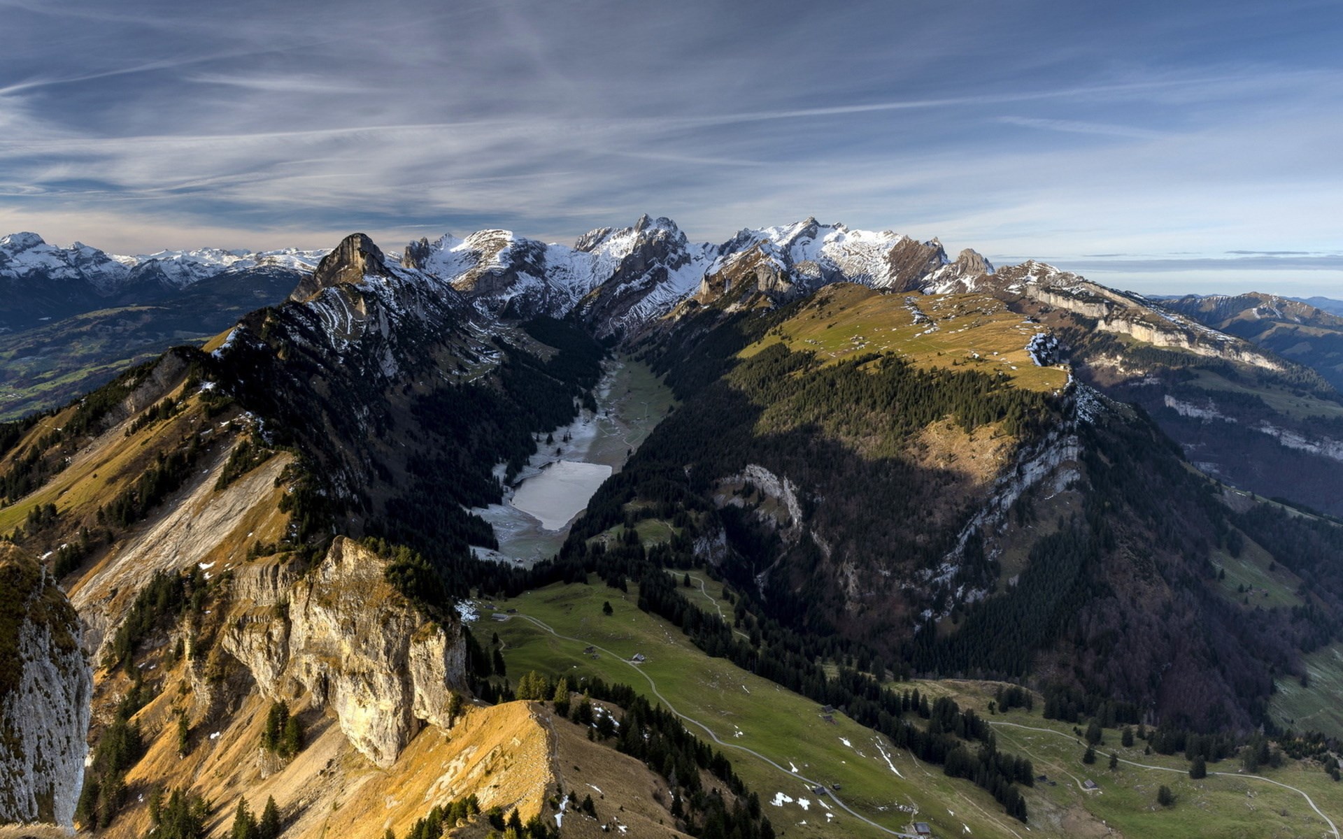 Aerial view of a mountain valley with a frozen lake HD Wallpaper