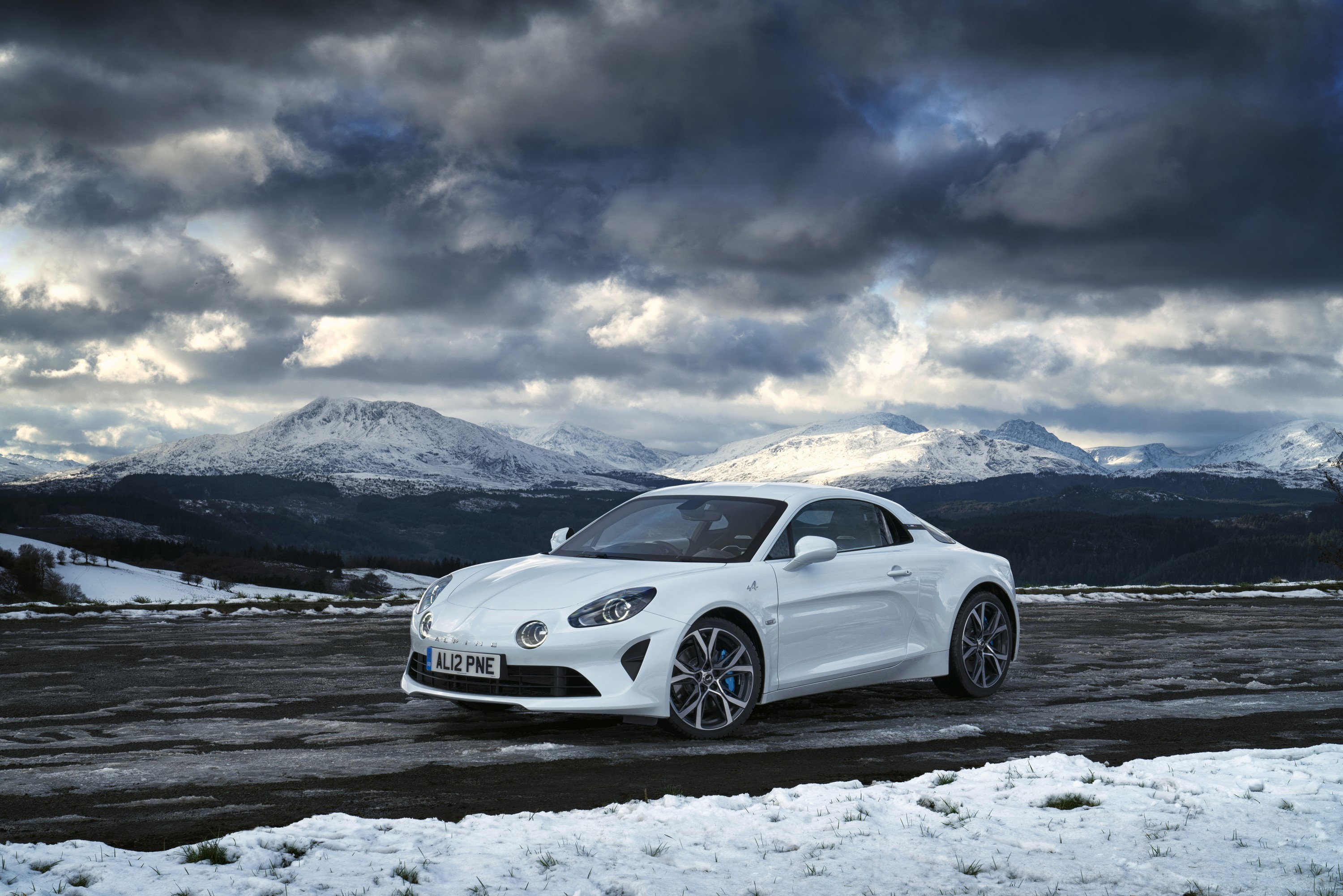 White 2018-19 Alpine A110 Pure car in snowy mountains HD Wallpaper