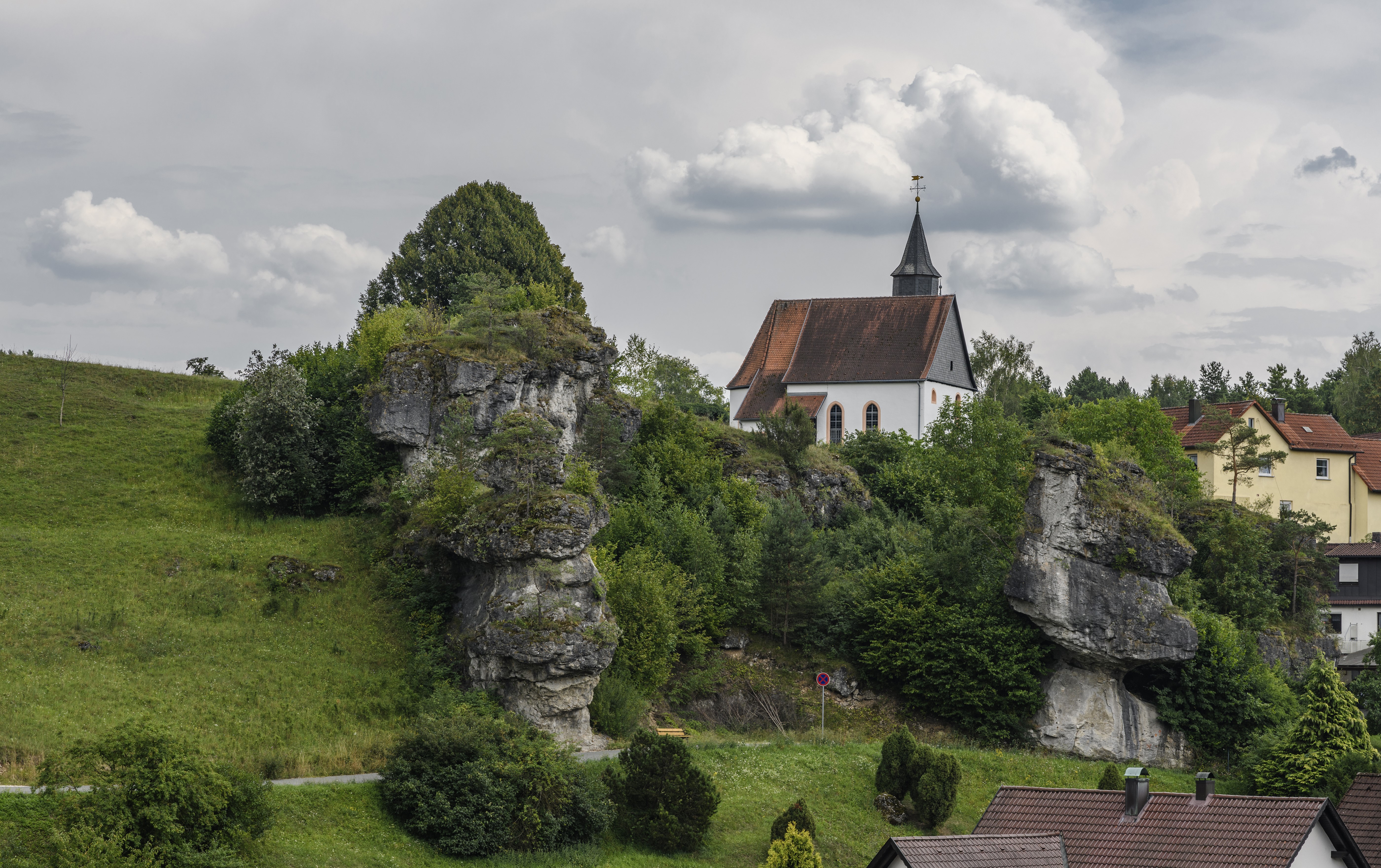 Church on a rocky hill in Hollfeld, Germany HD Wallpaper
