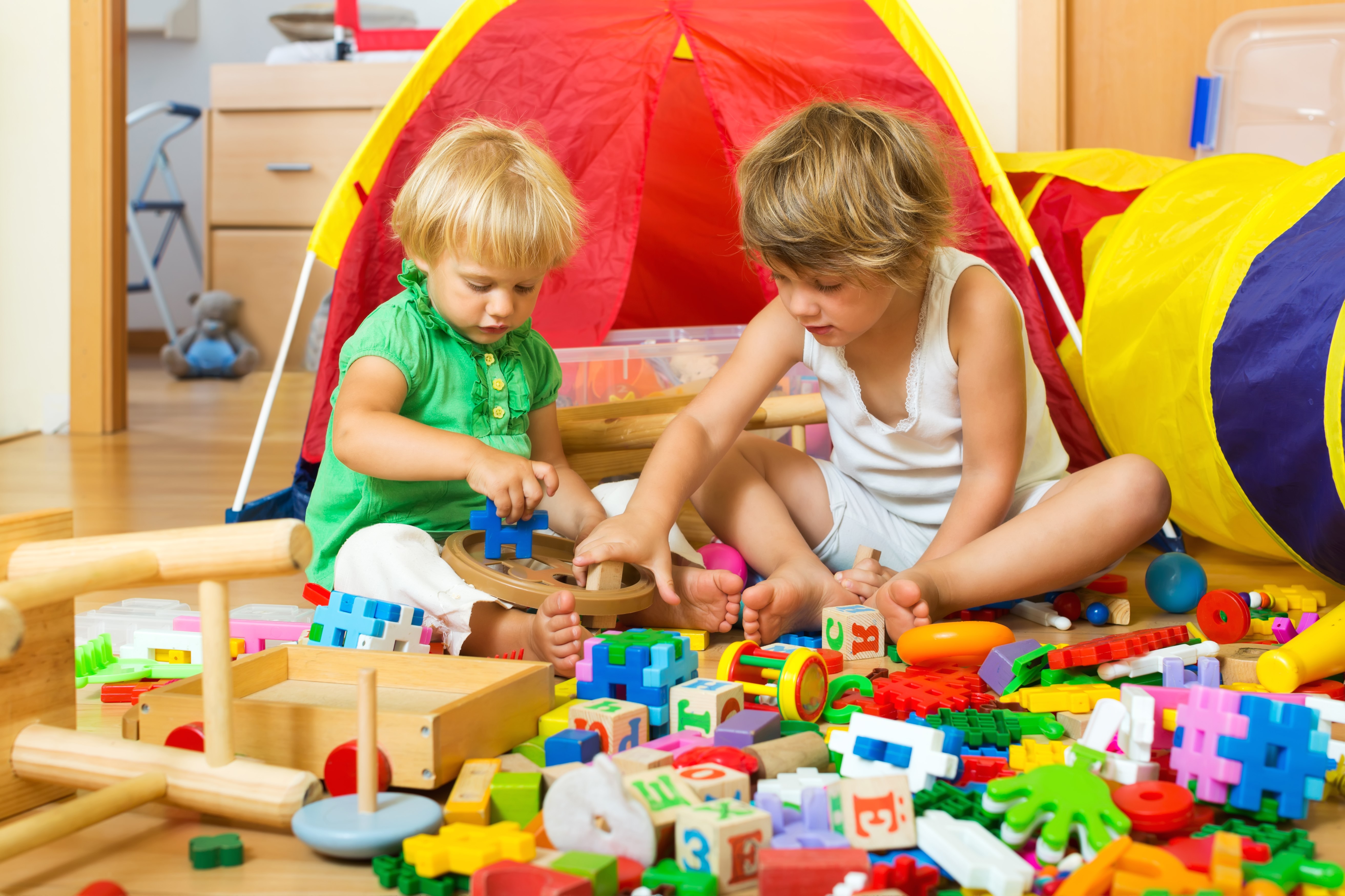 Two children playing with toys HD Wallpaper