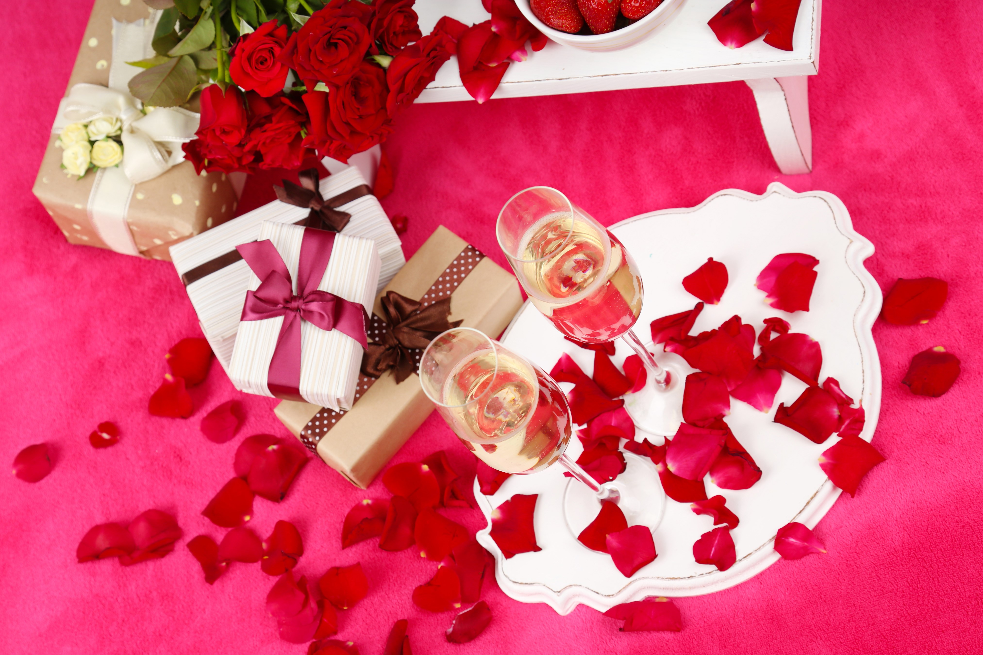 Champagne, Roses, Gifts, and Strawberries on Pink Background HD Wallpaper