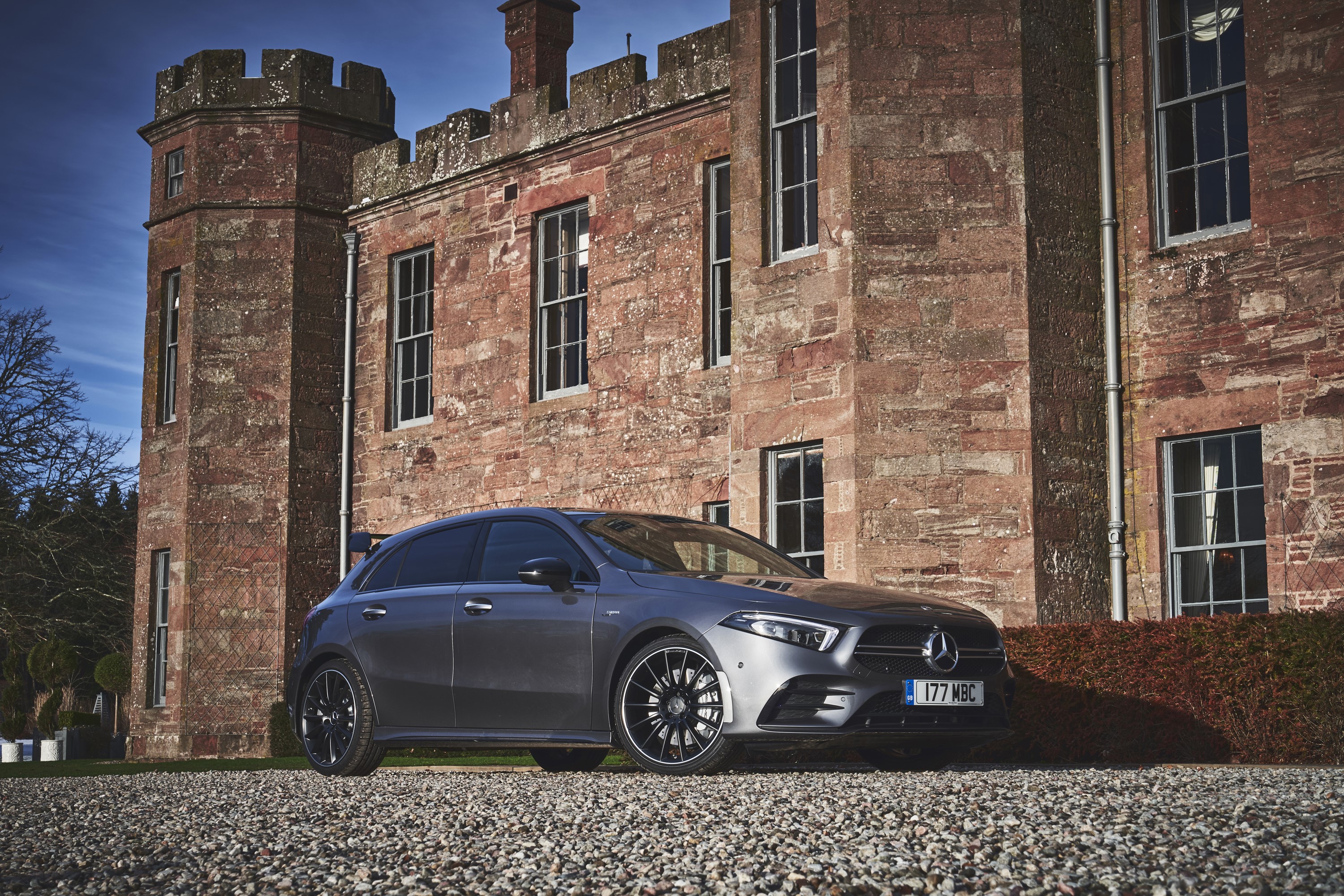 Mercedes-Benz AMG A 35 4MATIC in front of a castle HD Wallpaper