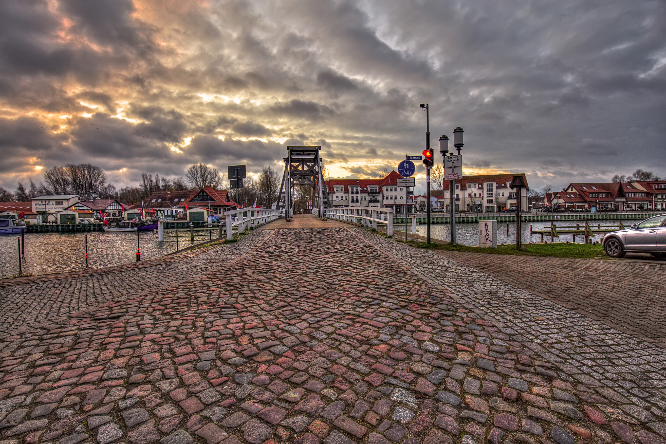 Bridge over a river in Greifswald, Germany at dusk HD Wallpaper
