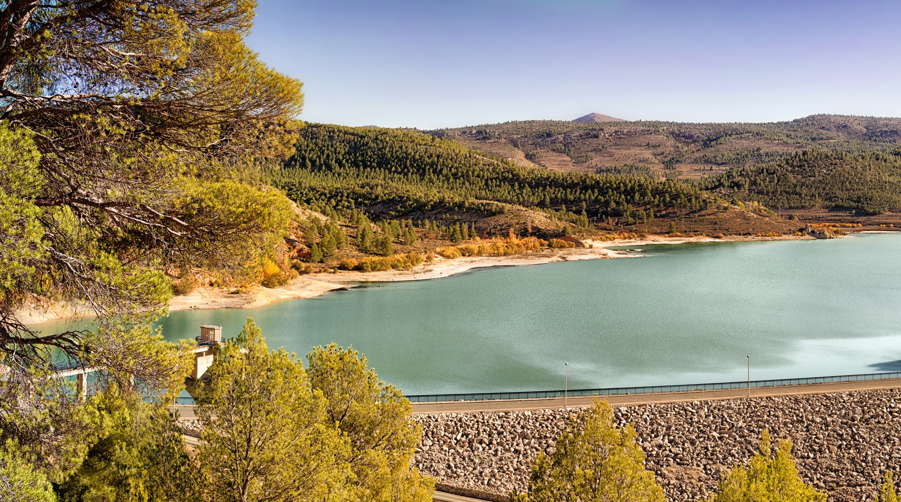 Reservoir and forested hills in Spain during autumn HD Wallpaper
