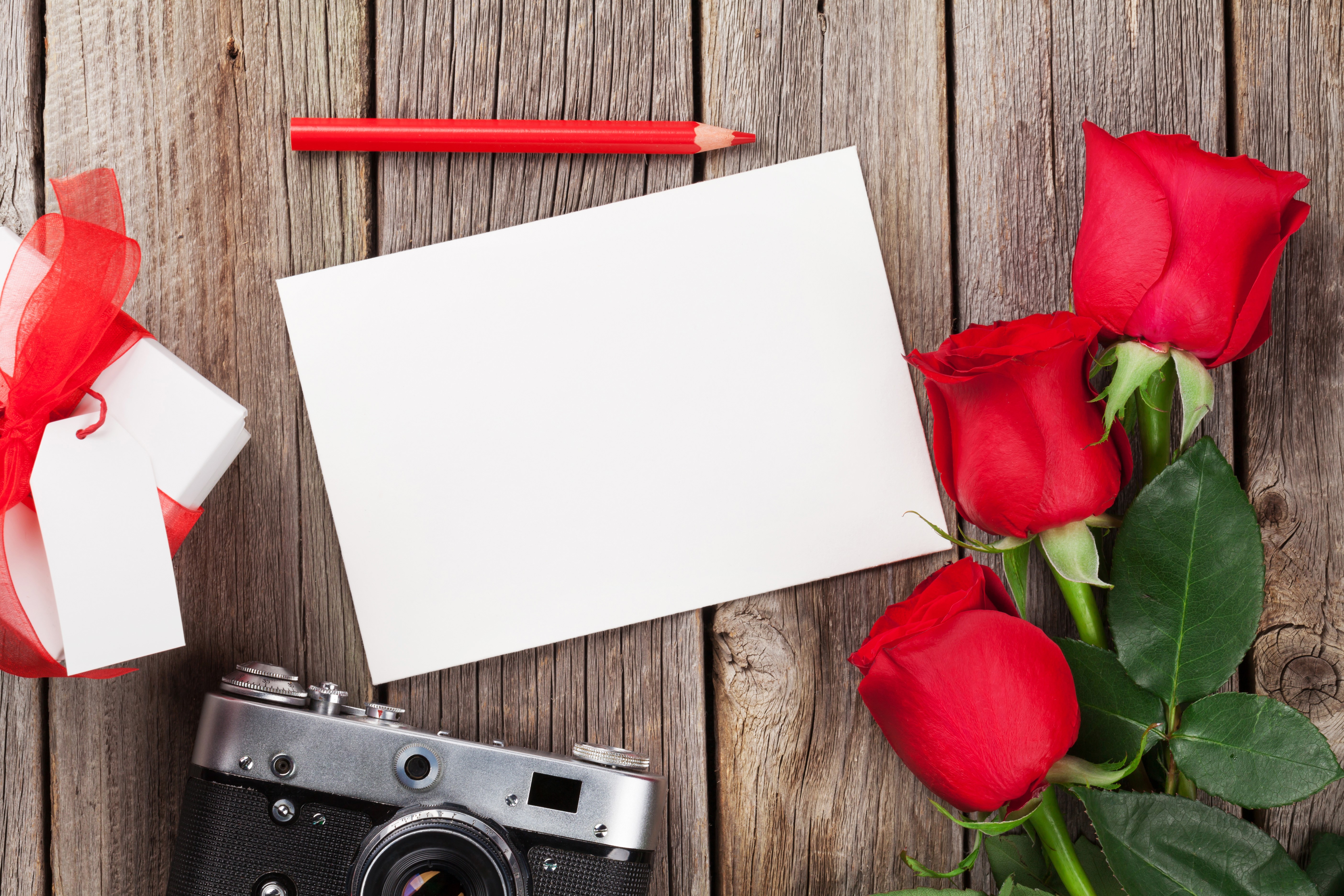 Roses, Gift, Camera, Paper, and Pencil on Wood HD Wallpaper