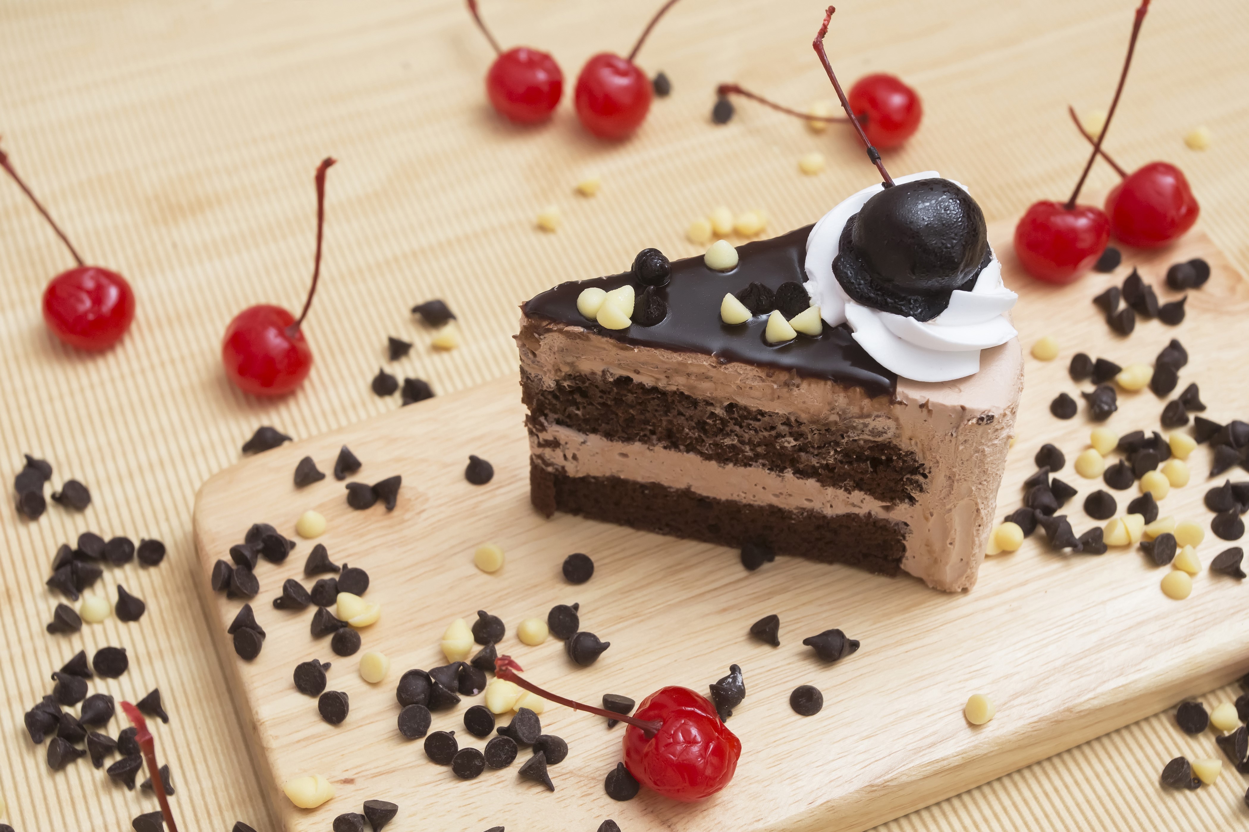 Chocolate cake slice with cherries and chocolate chips HD Wallpaper