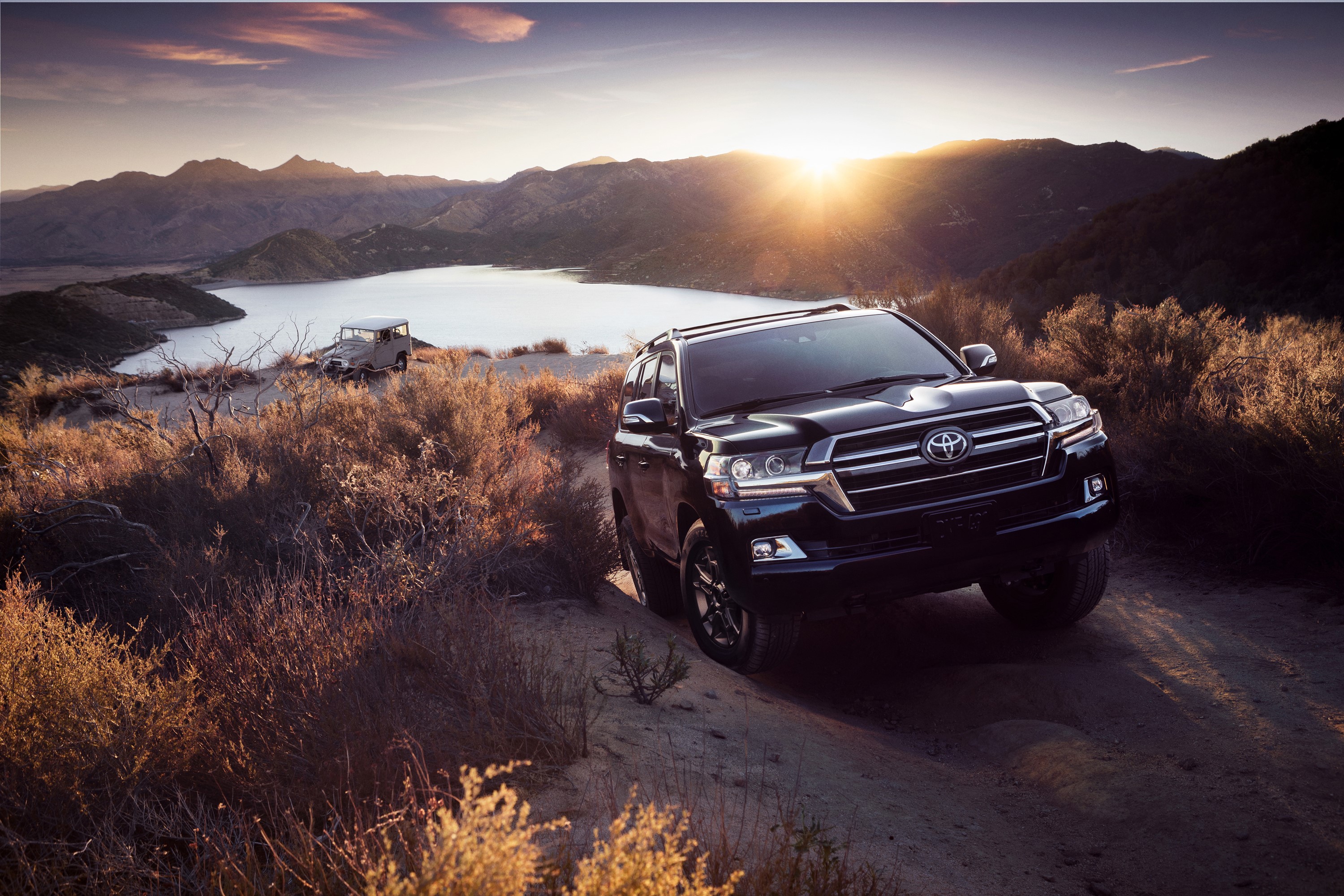 Black Toyota Land Cruiser SUV on a dirt road HD Wallpaper