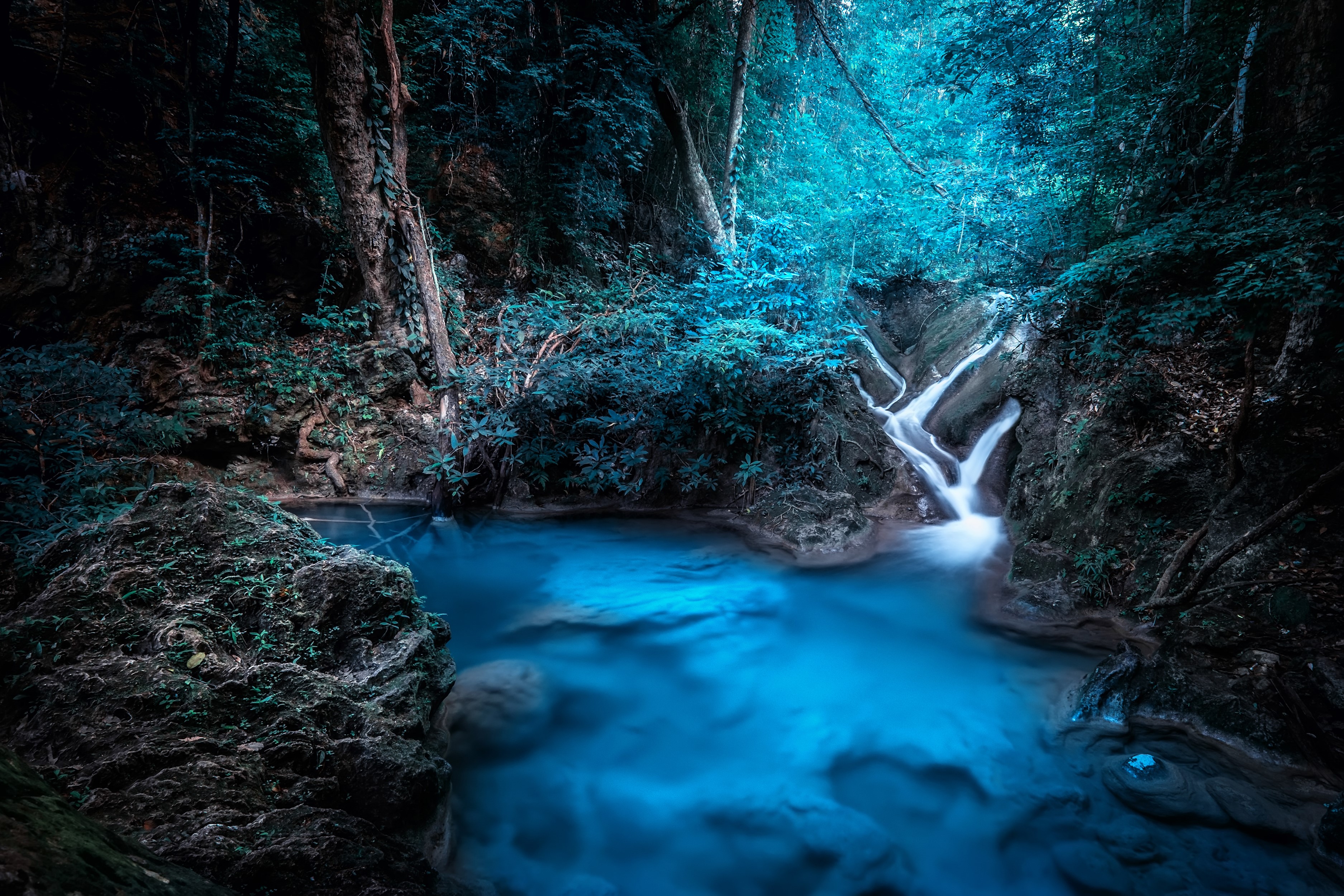 Waterfall in a tropical forest in Kanchanaburi, Thailand HD Wallpaper