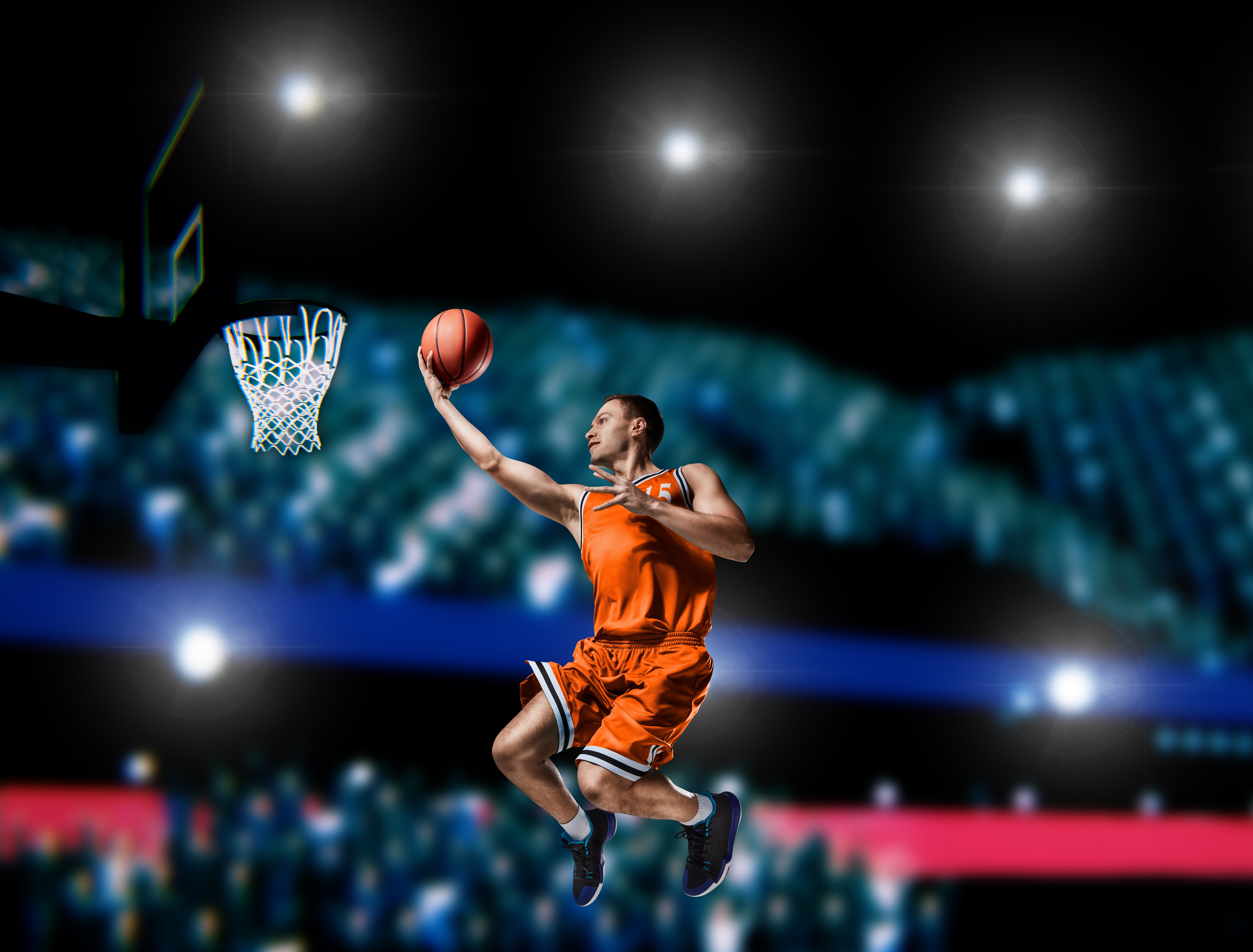 Basketball player in orange uniform jumping with ball HD Wallpaper