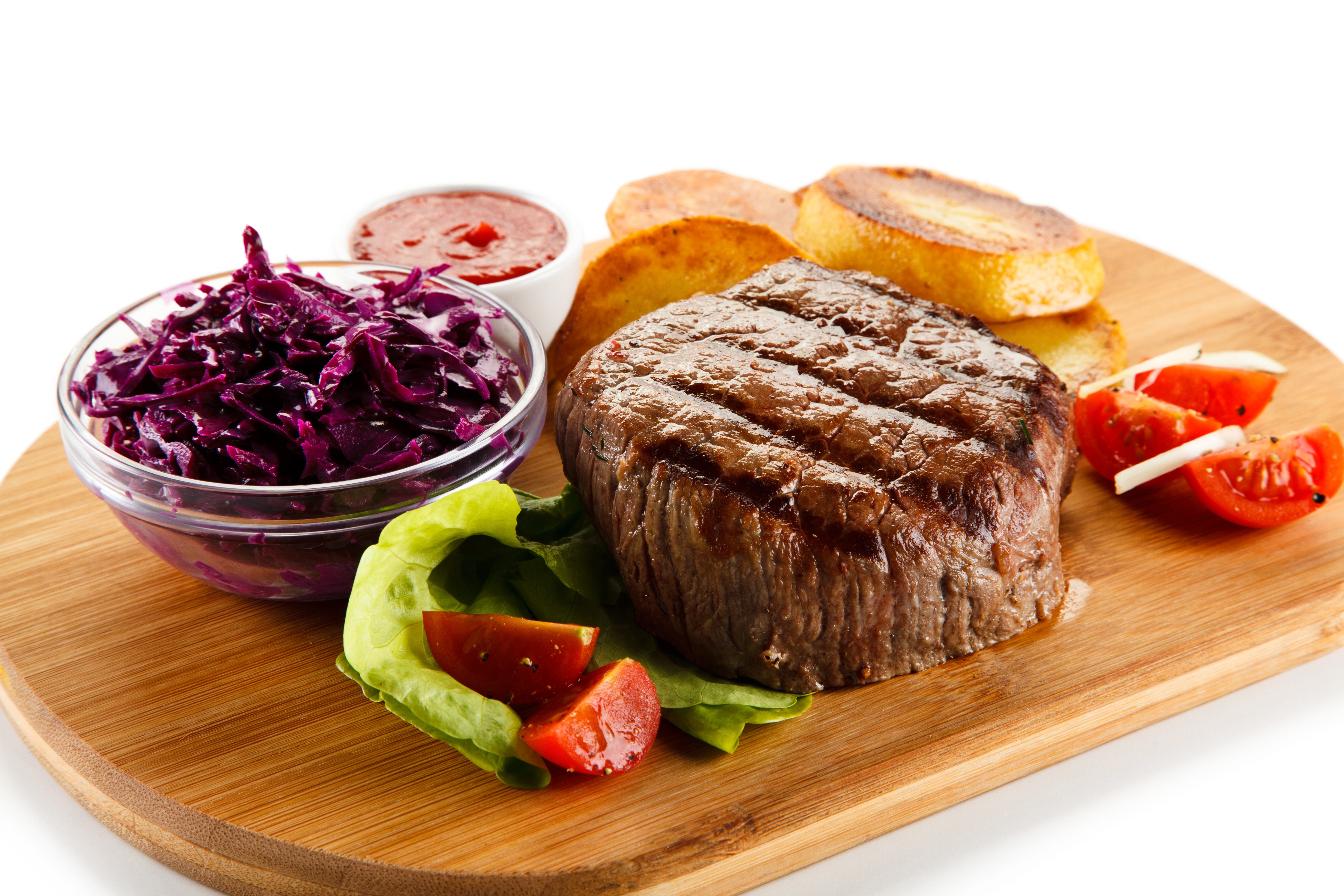 Grilled steak with coleslaw and potatoes on a cutting board HD Wallpaper