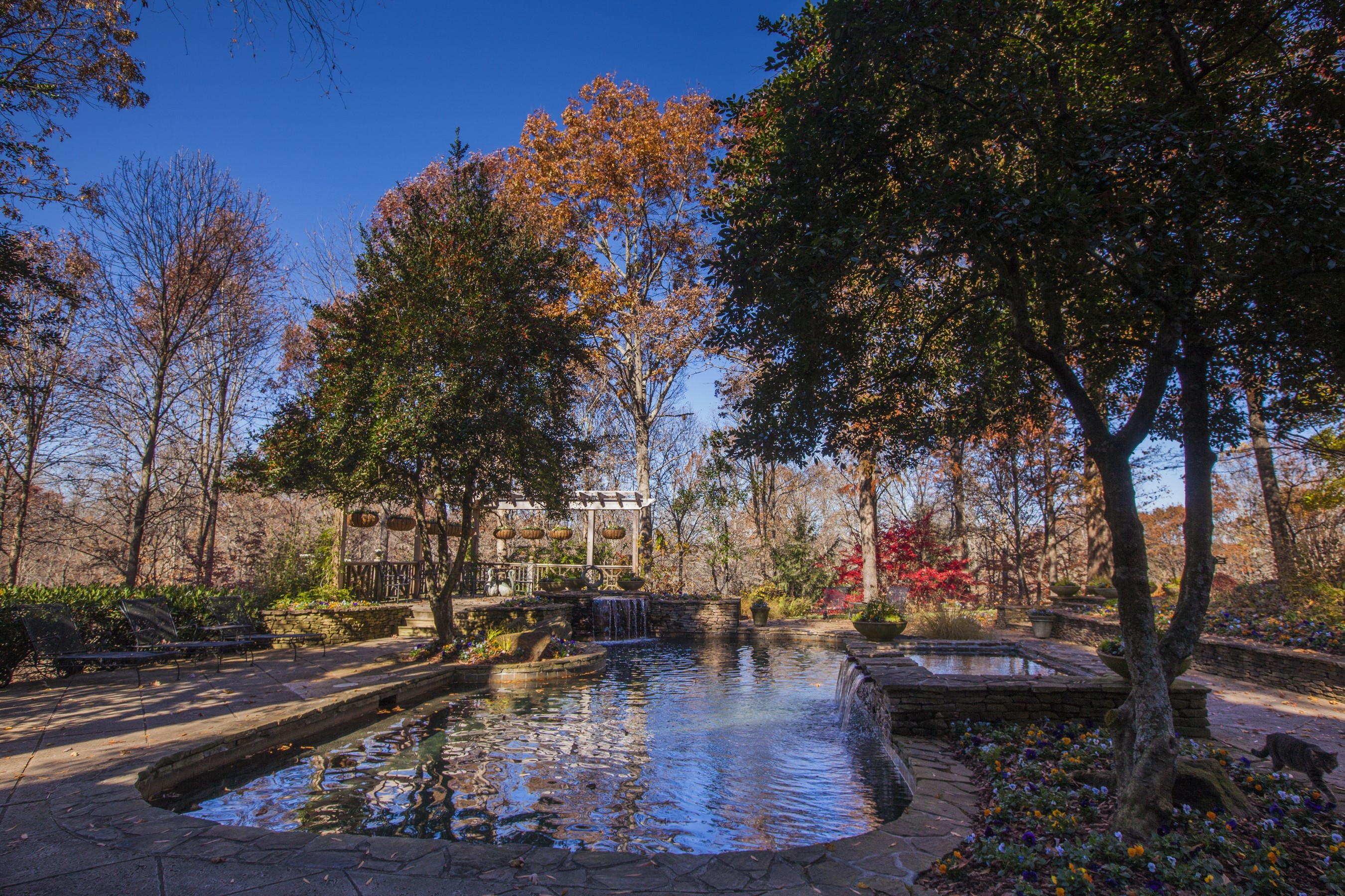 Gibbs Gardens in Autumn with Pond and Waterfalls HD Wallpaper