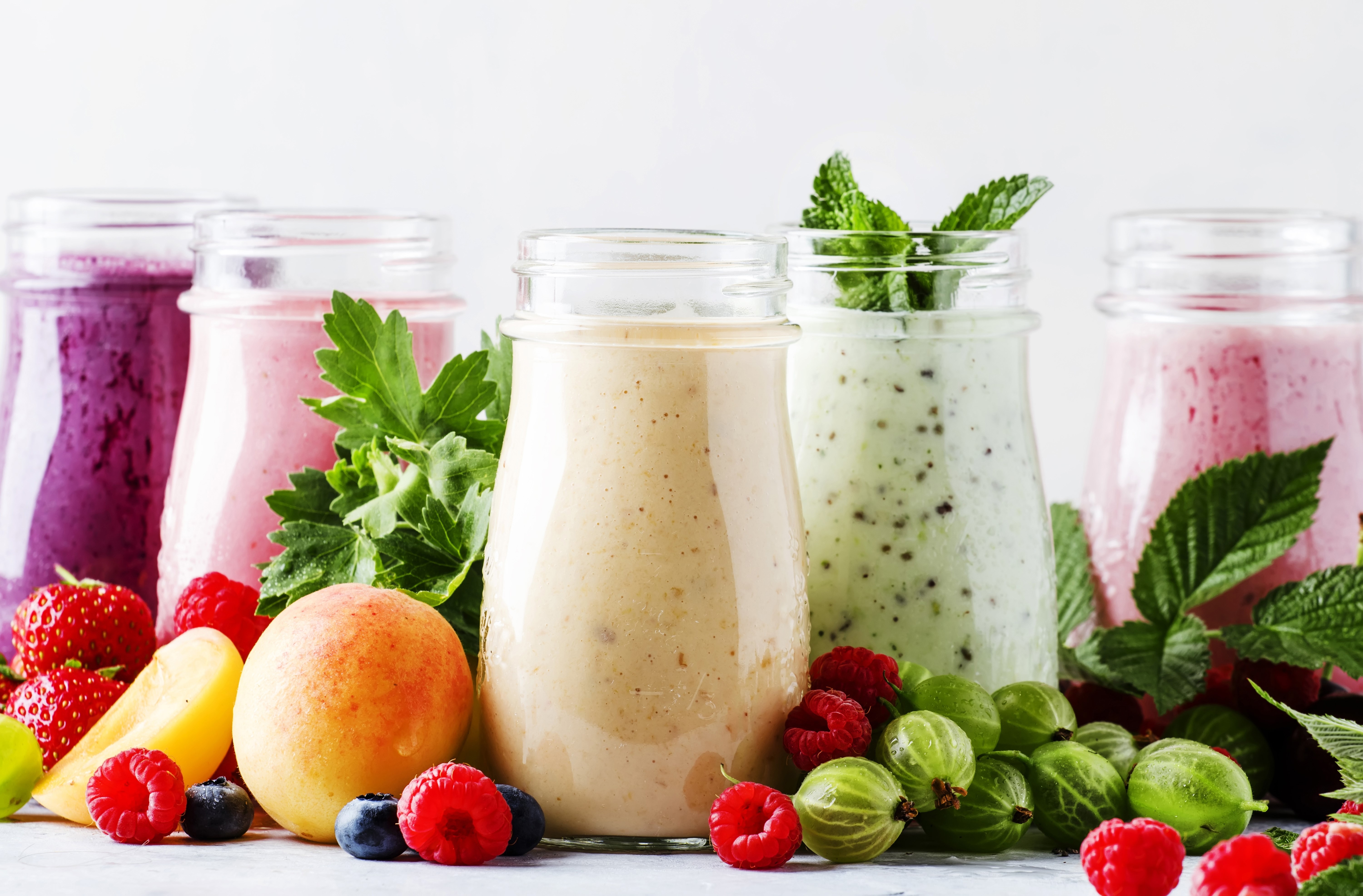 Assortment of Fruit Smoothies in Jars HD Wallpaper
