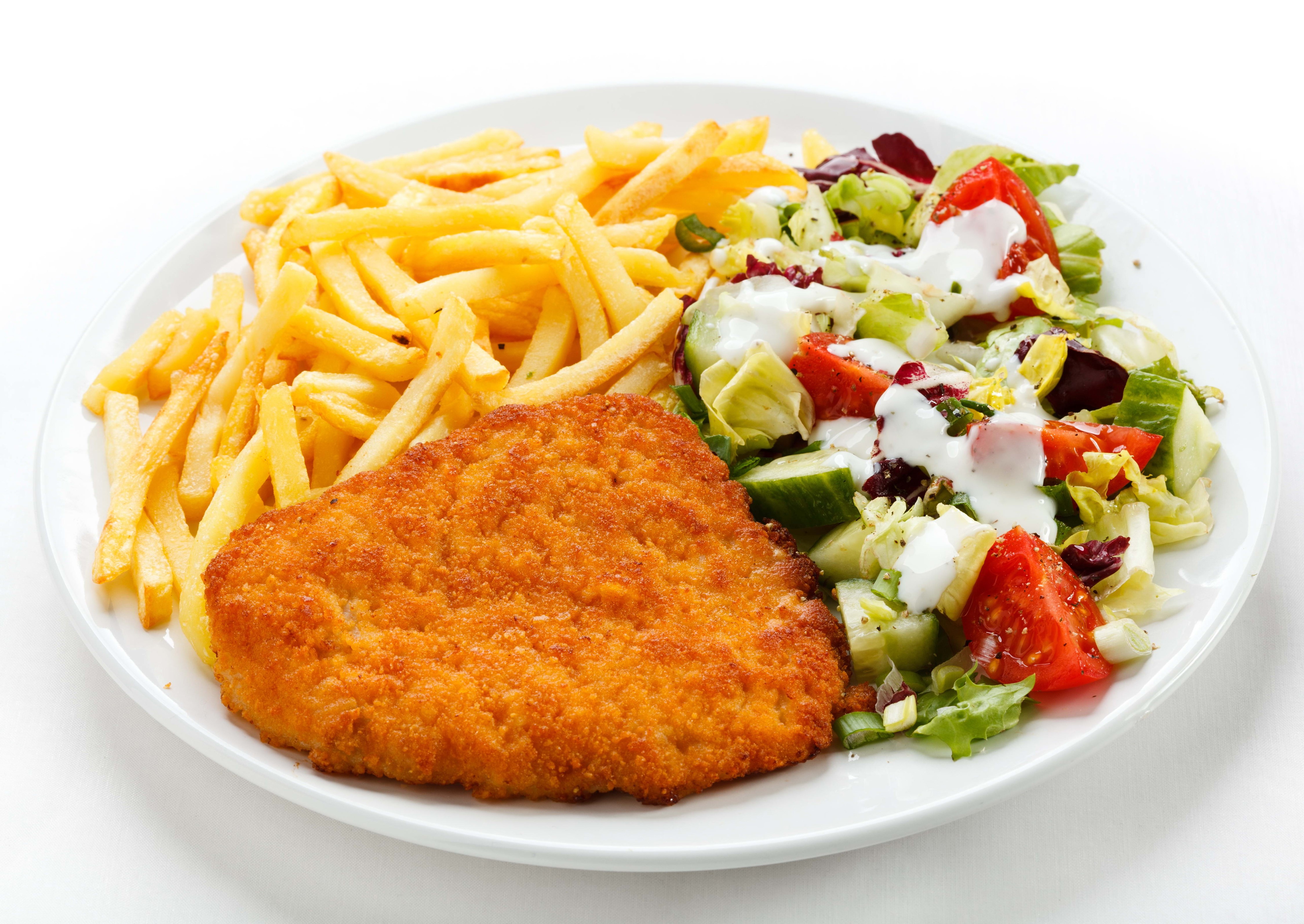 Breaded meat with french fries and salad on a plate HD Wallpaper