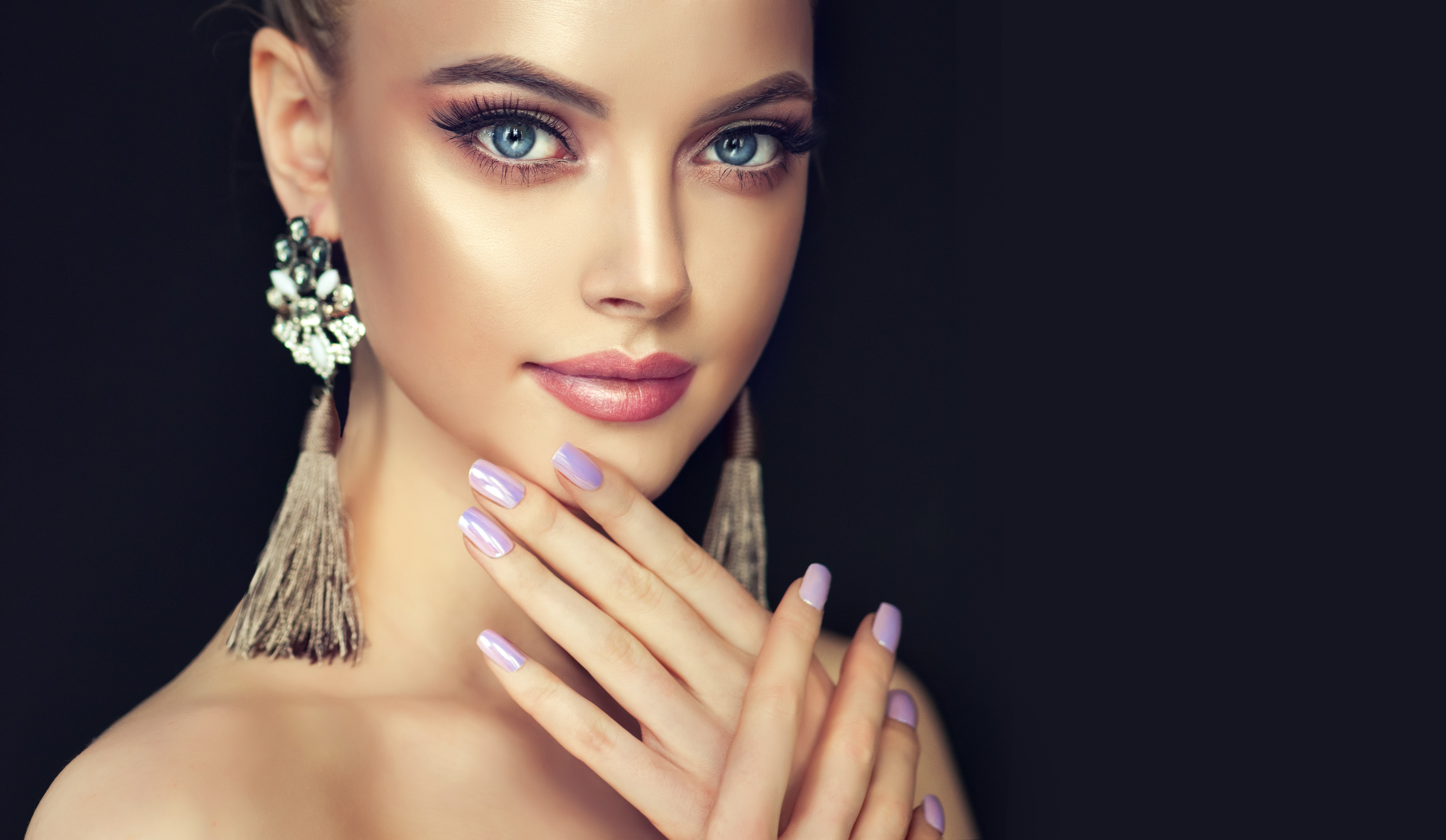 Woman with Makeup and Earrings on Black Background HD Wallpaper