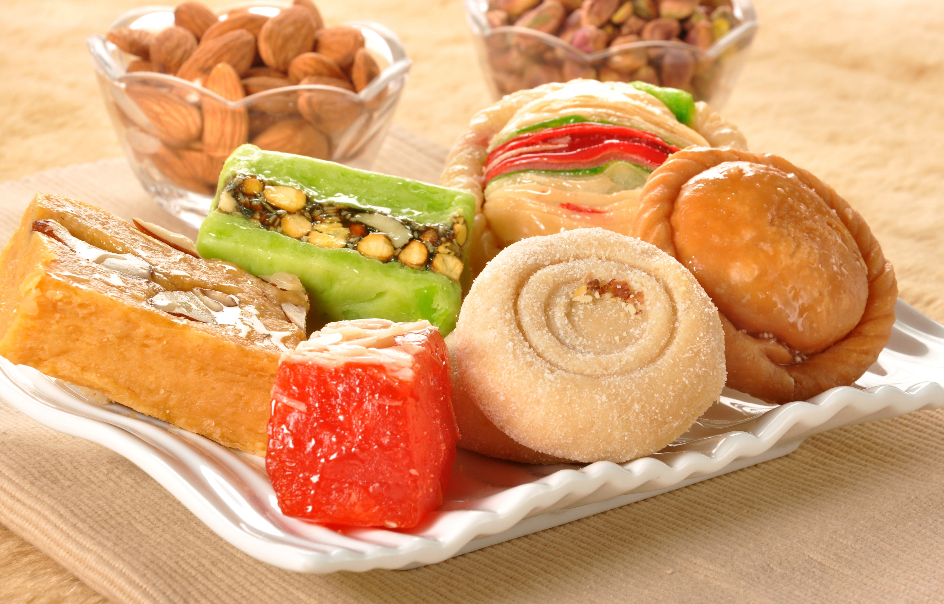 Assortment of Indian sweets and nuts HD Wallpaper