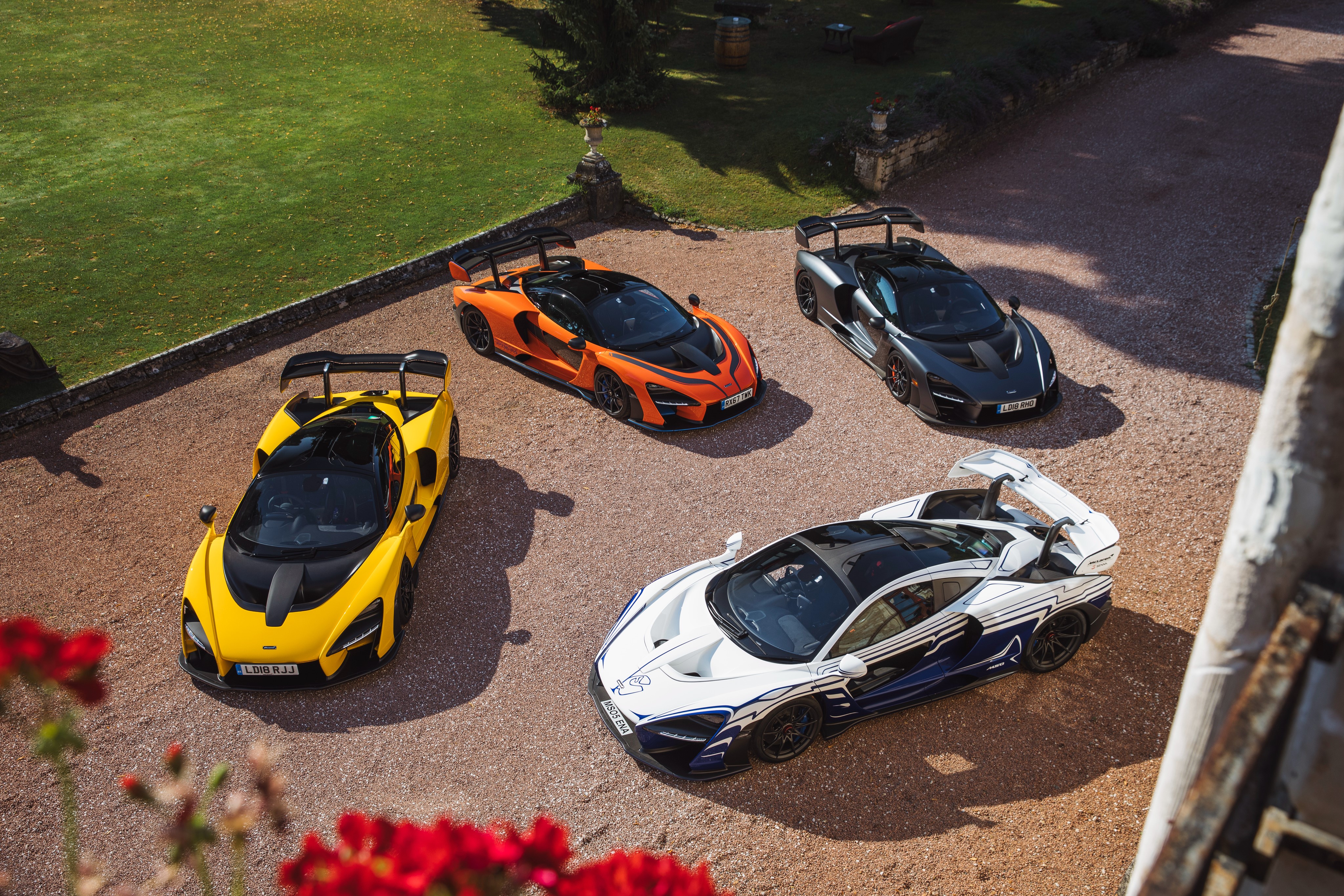 Four McLaren Senna cars from above HD Wallpaper