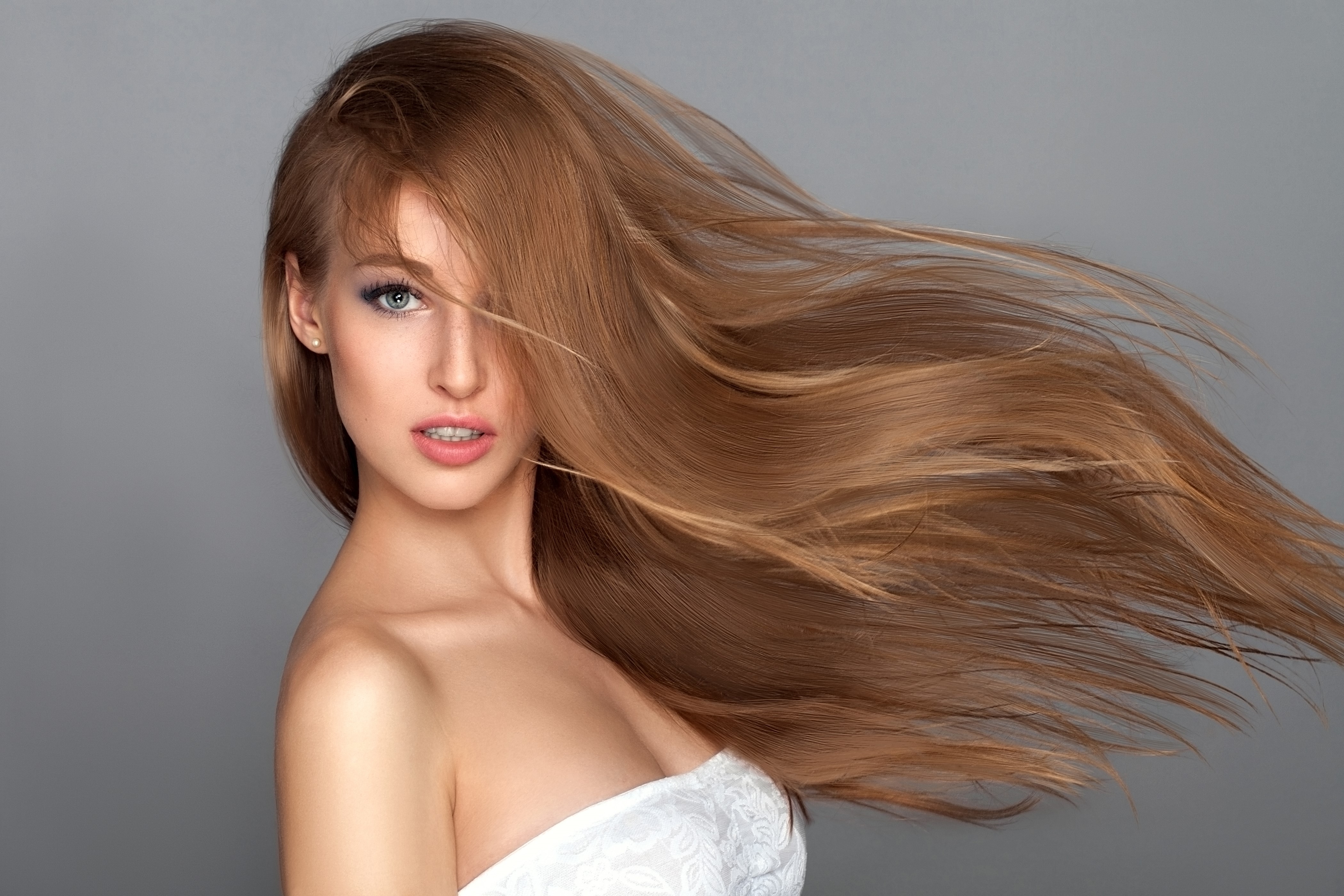 Brown haired woman with hair blowing HD Wallpaper