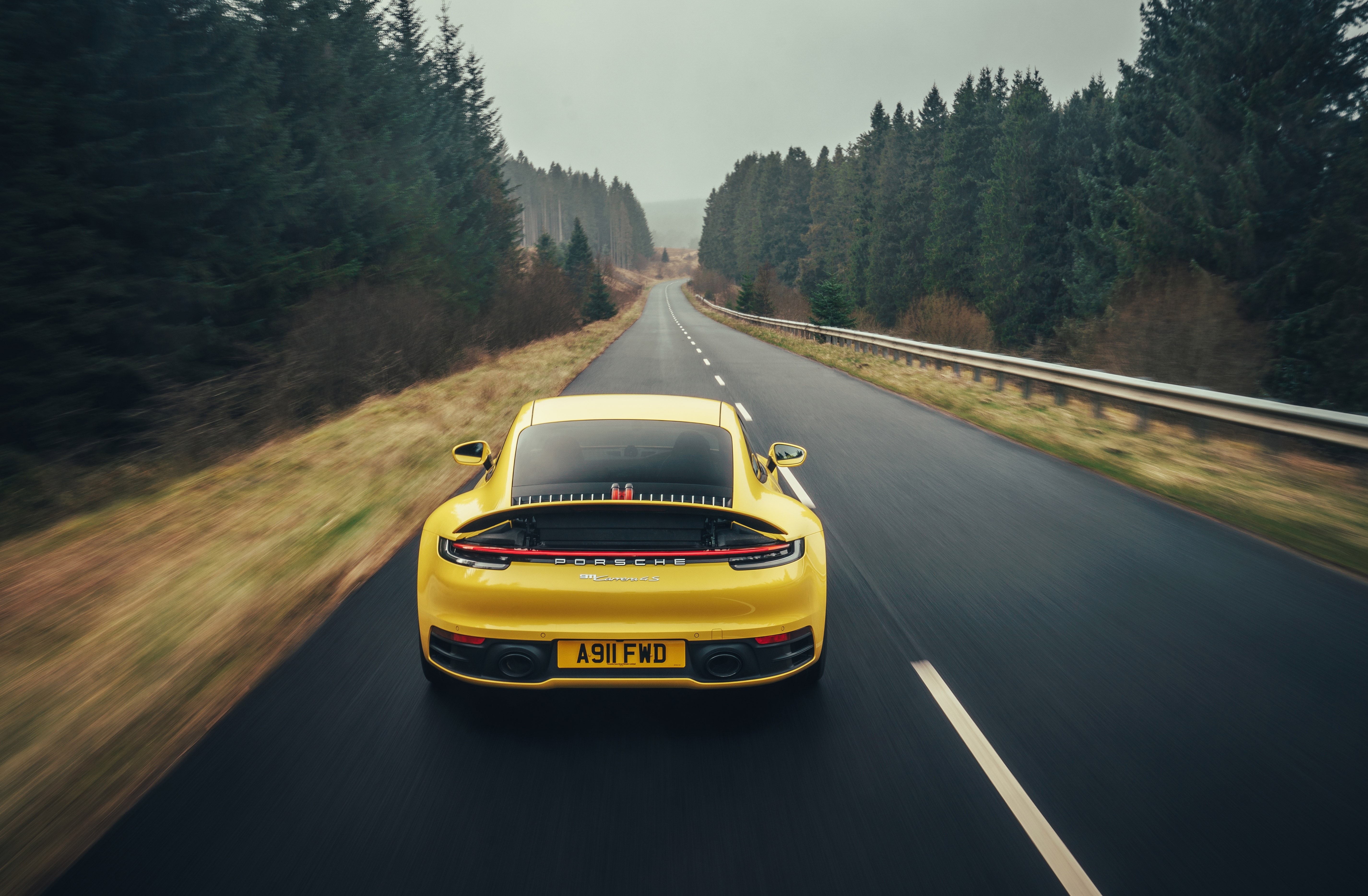 Yellow Porsche 911 Carrera 4S 2019 on a road HD Wallpaper