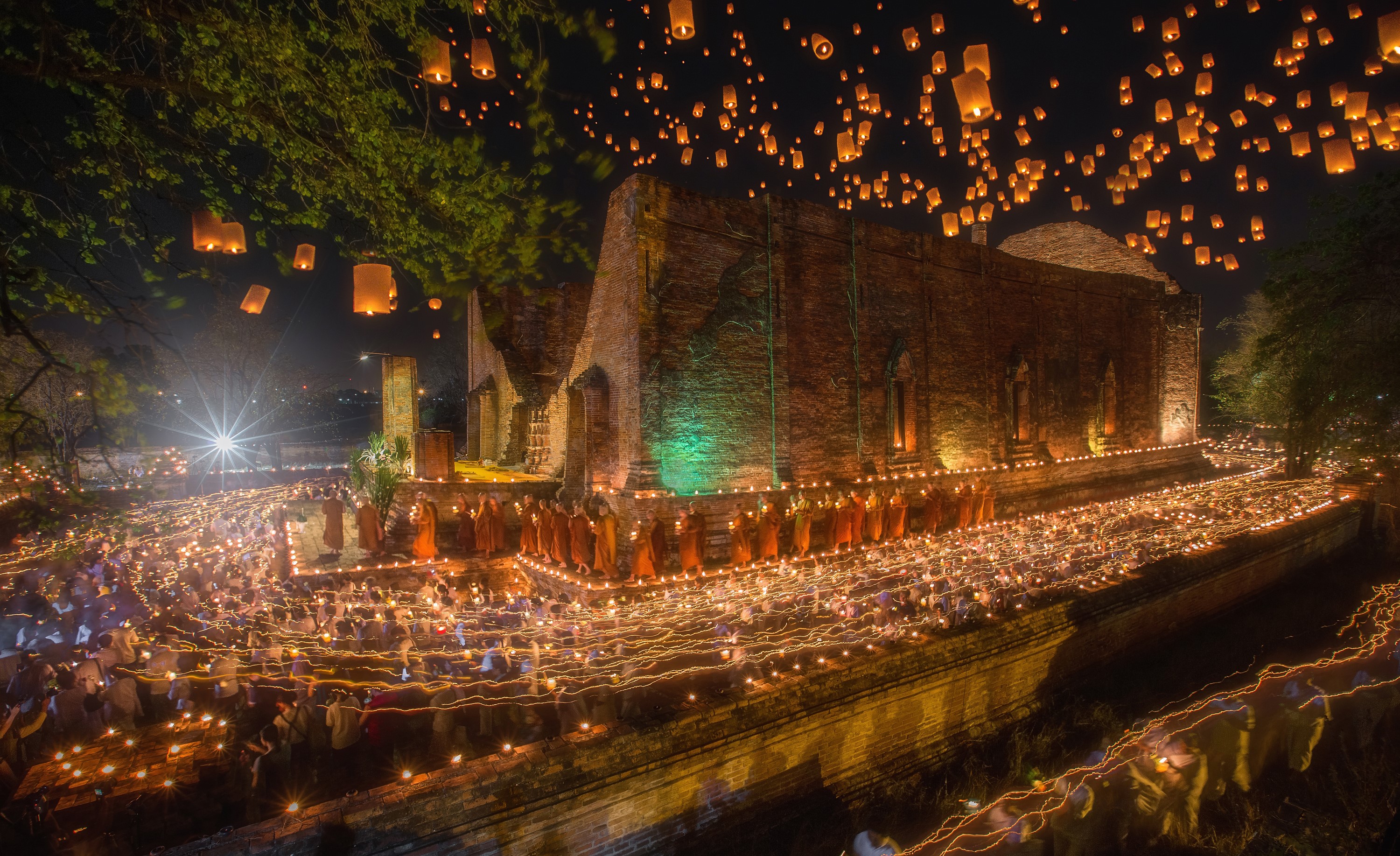 Monks and lanterns at ancient temple in Ayutthaya, Thailand HD Wallpaper