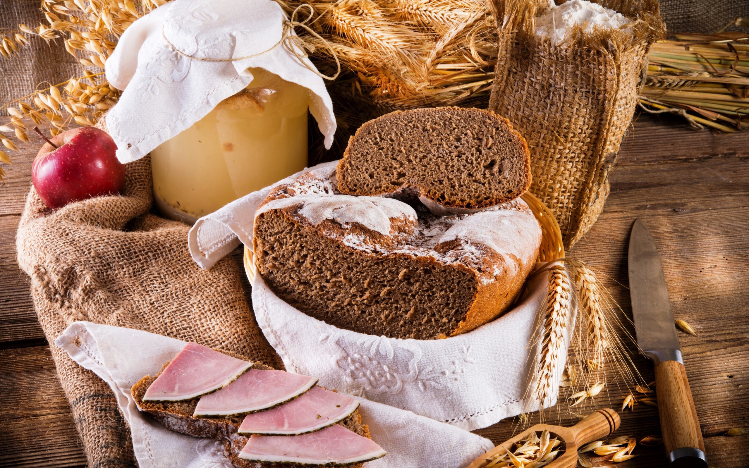 Bread, Ham, and Wheat on a Wooden Table HD Wallpaper