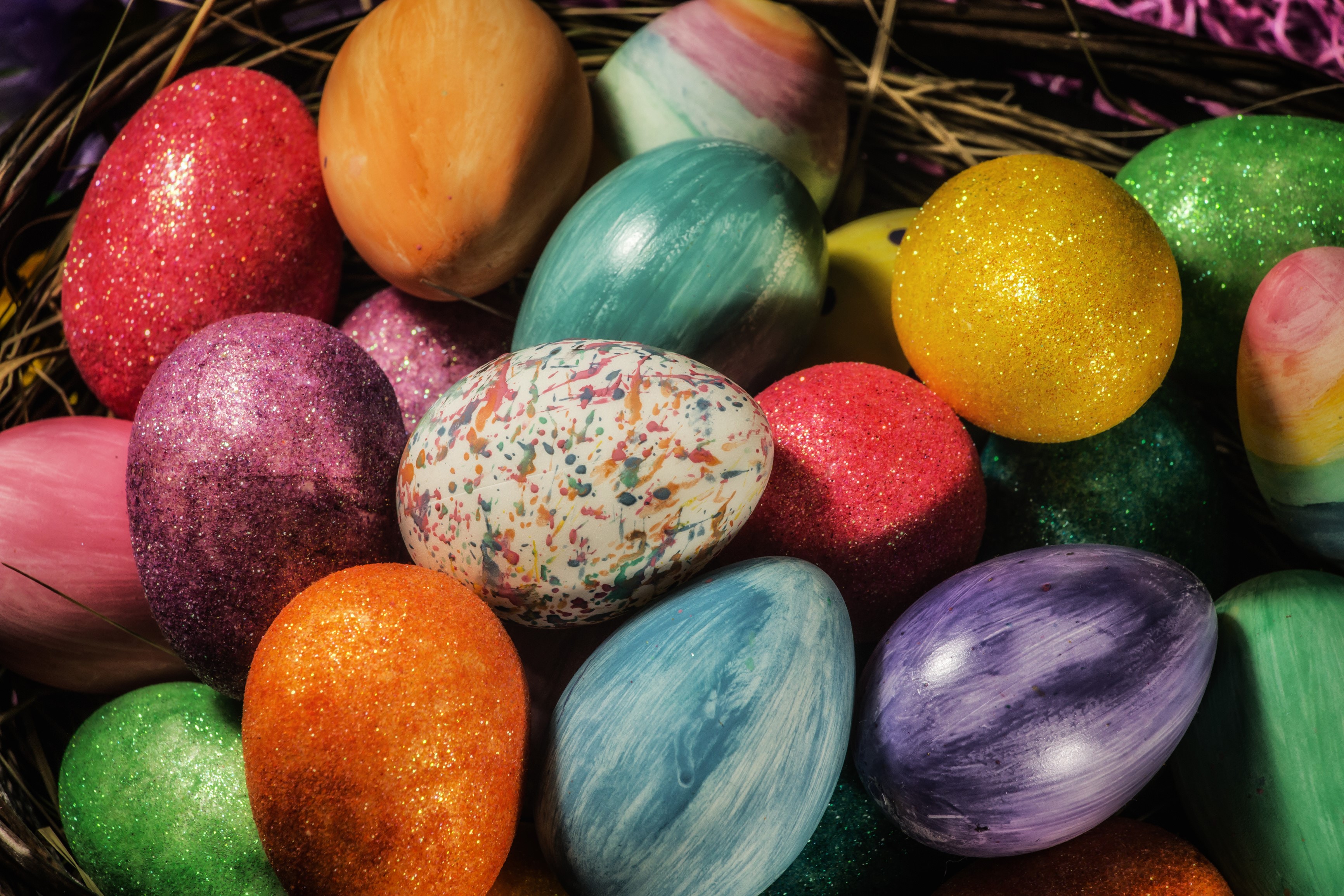A colorful assortment of Easter eggs in a nest HD Wallpaper