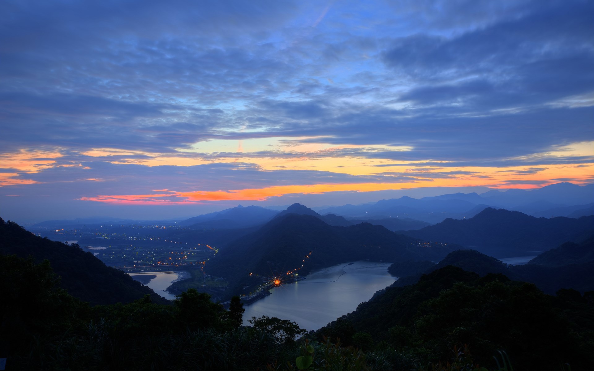 Mountain landscape with lake and city lights at dusk HD Wallpaper