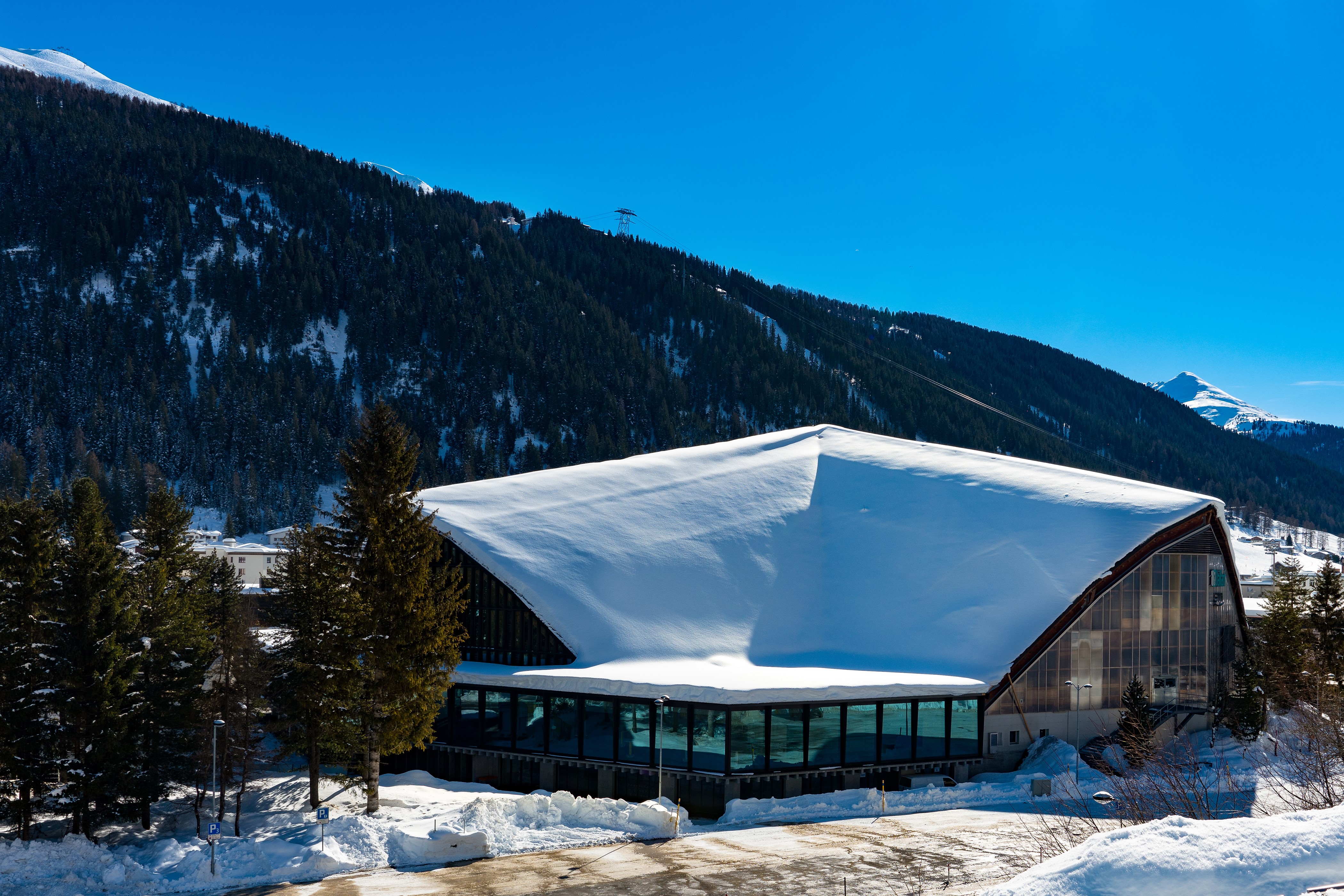 Davos, Switzerland Winter Scene with Snow-Covered Building HD Wallpaper