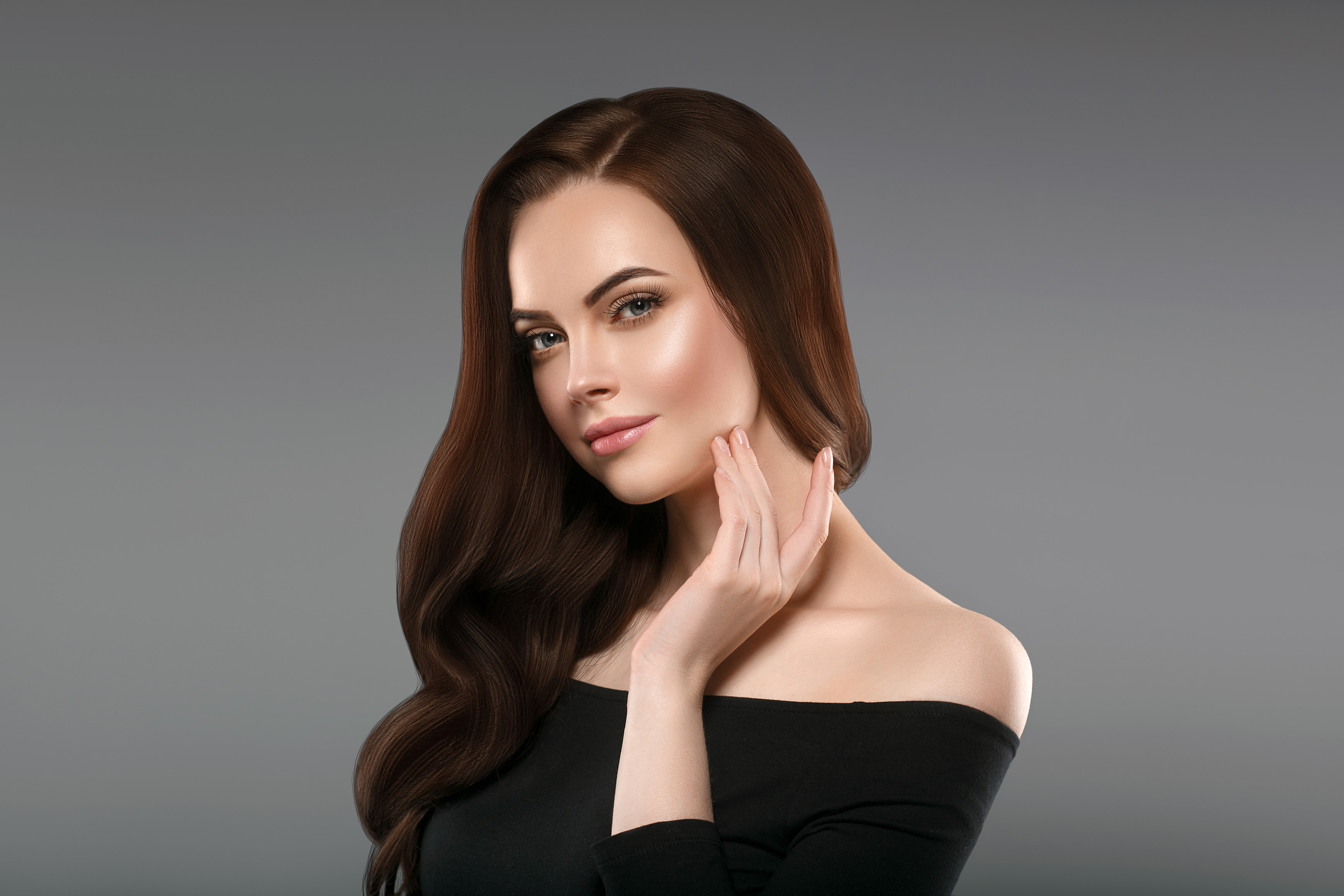 Woman with long brown hair touching her neck HD Wallpaper