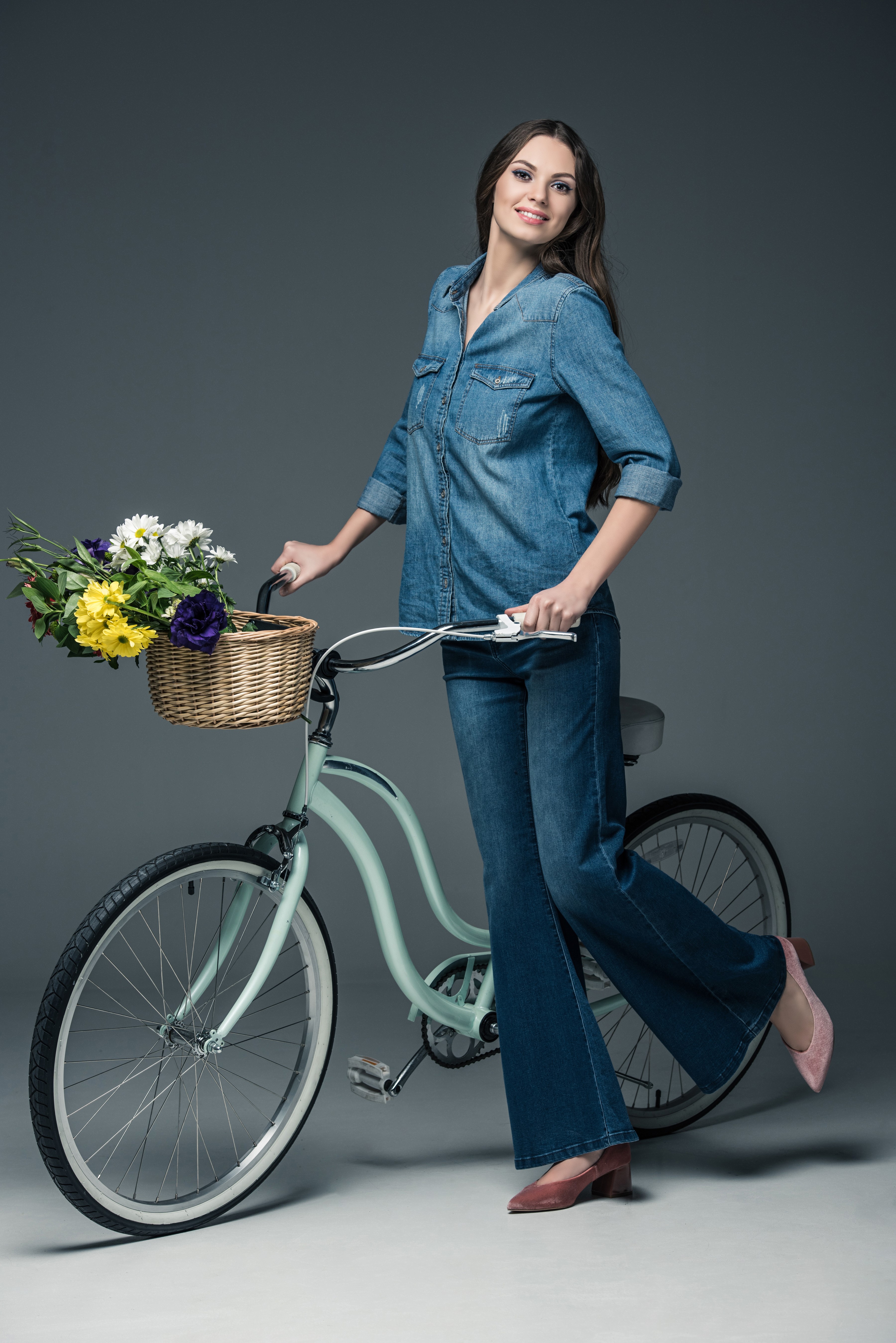 Woman with flowers on a bicycle HD Phone Wallpaper