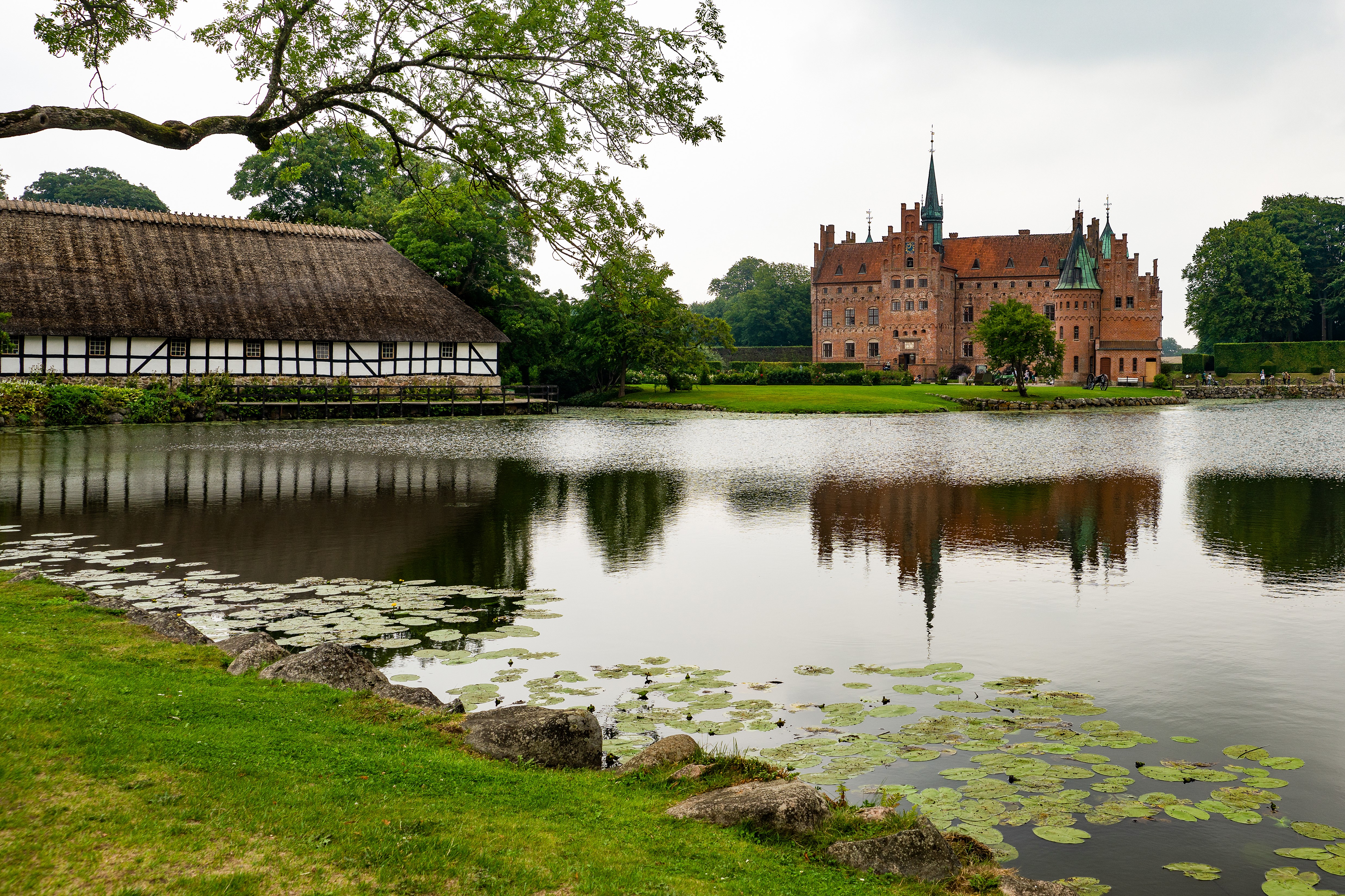 Egeskov Castle and pond in Denmark HD Wallpaper