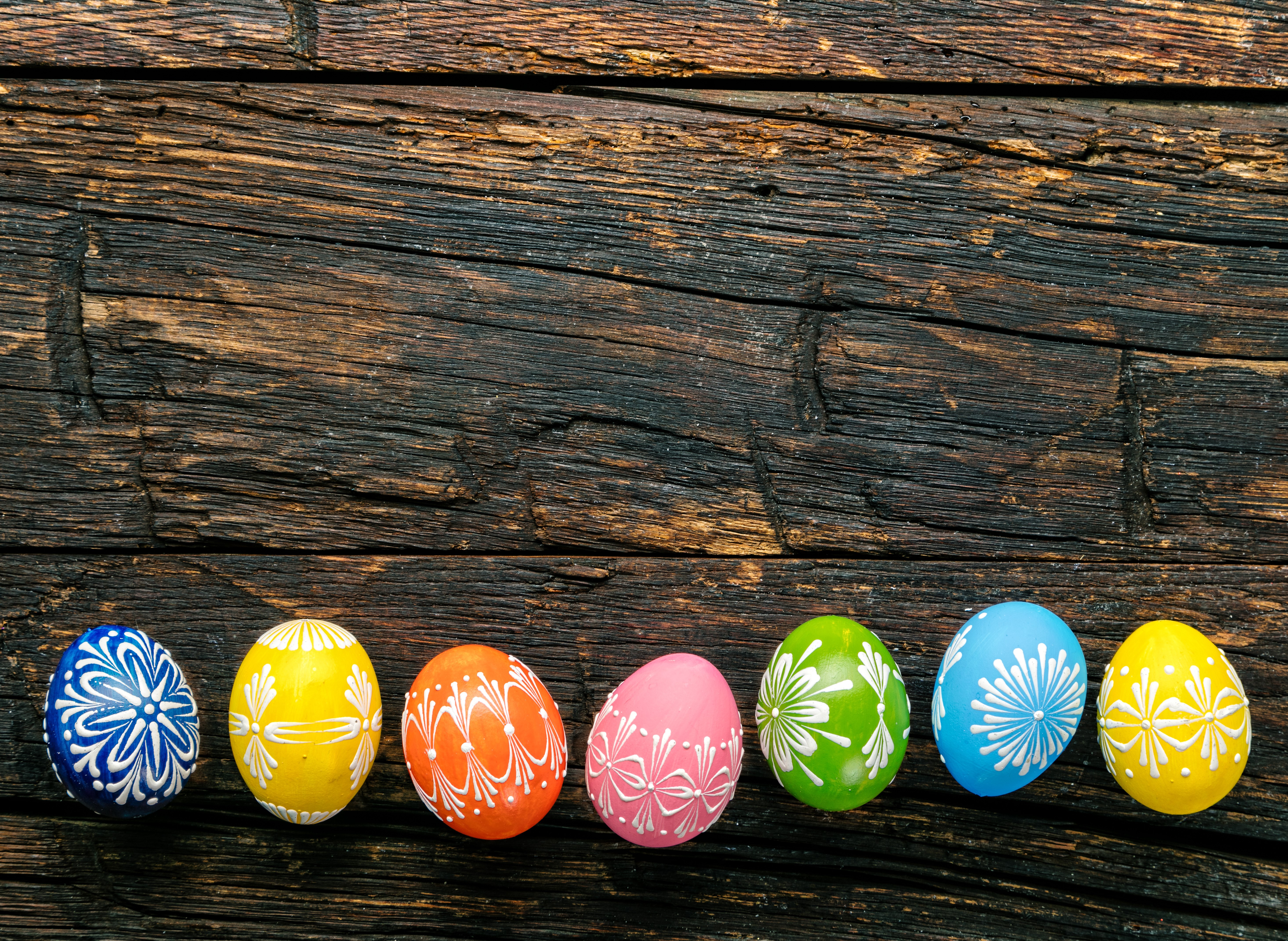 Easter eggs with designs on wood planks HD Wallpaper