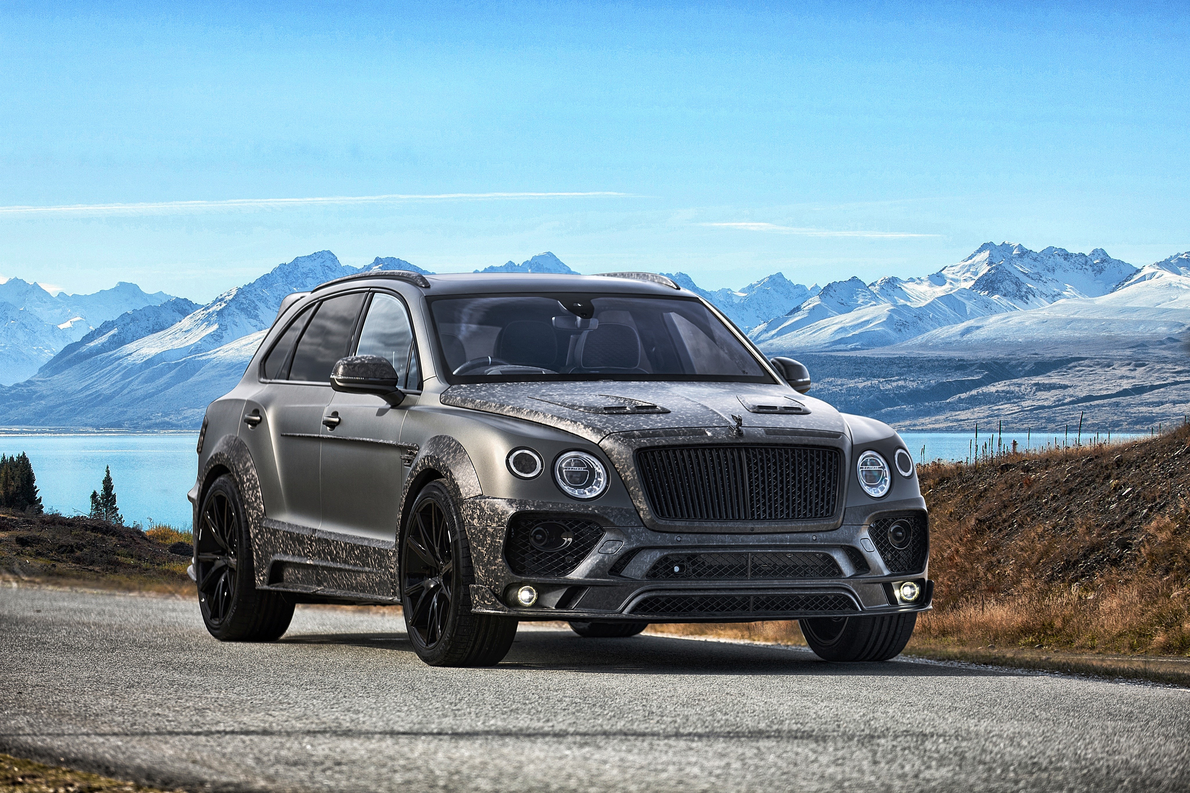 Grey Bentley Bentayga SUV in a mountain landscape HD Wallpaper