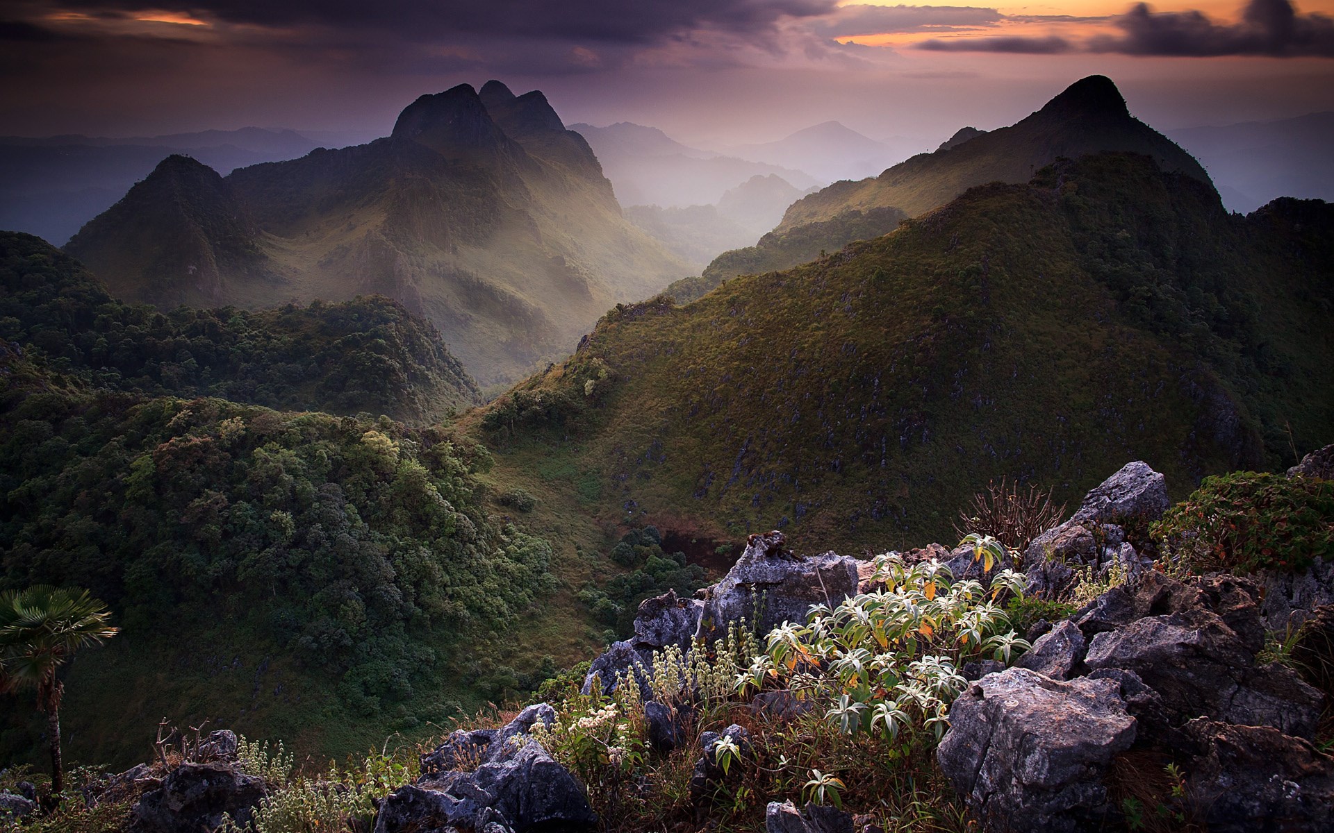 Misty mountains at sunrise with rocky foreground HD Wallpaper