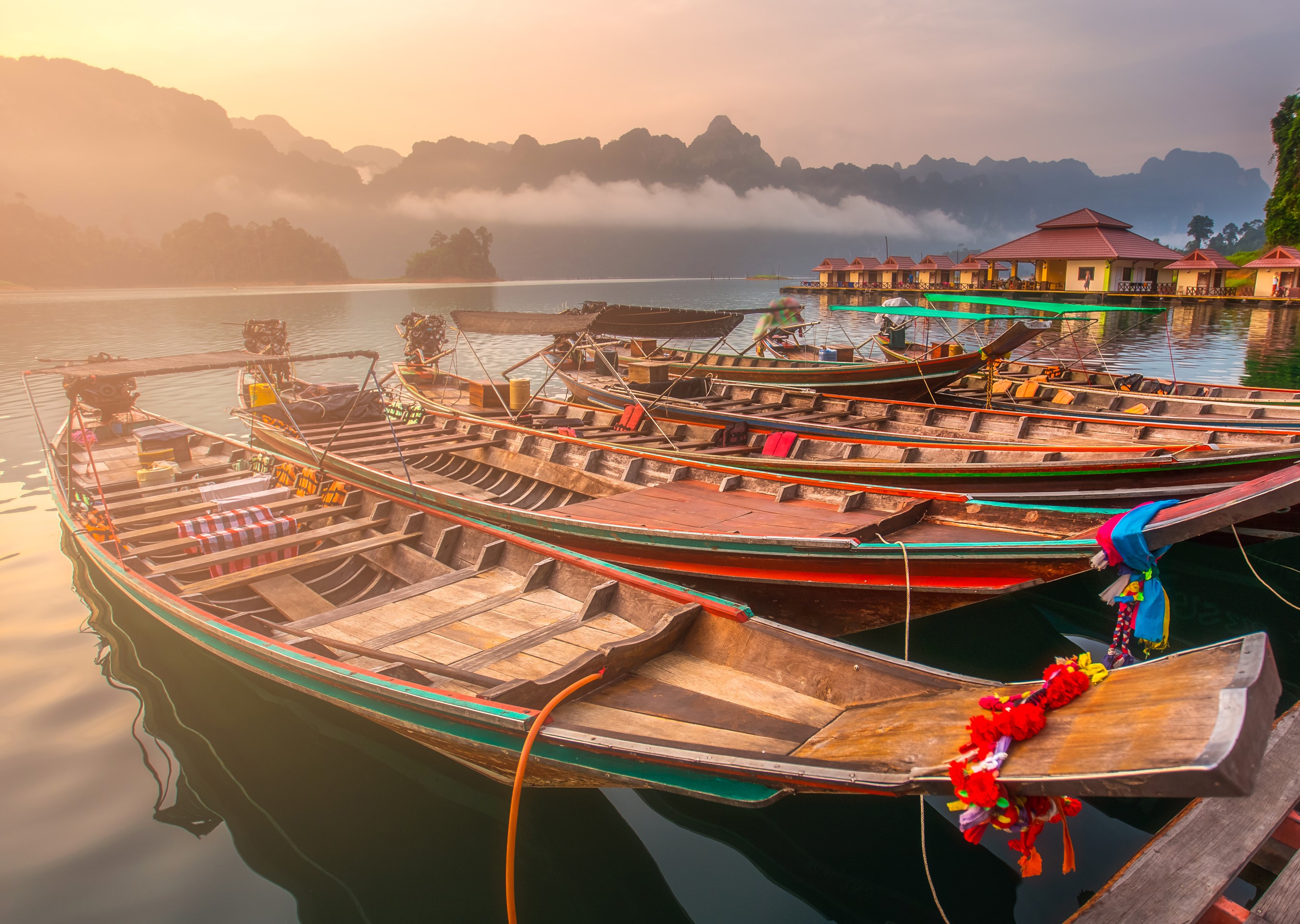 Boats docked at Ratchaprapa Dam, Thailand during sunrise HD Wallpaper