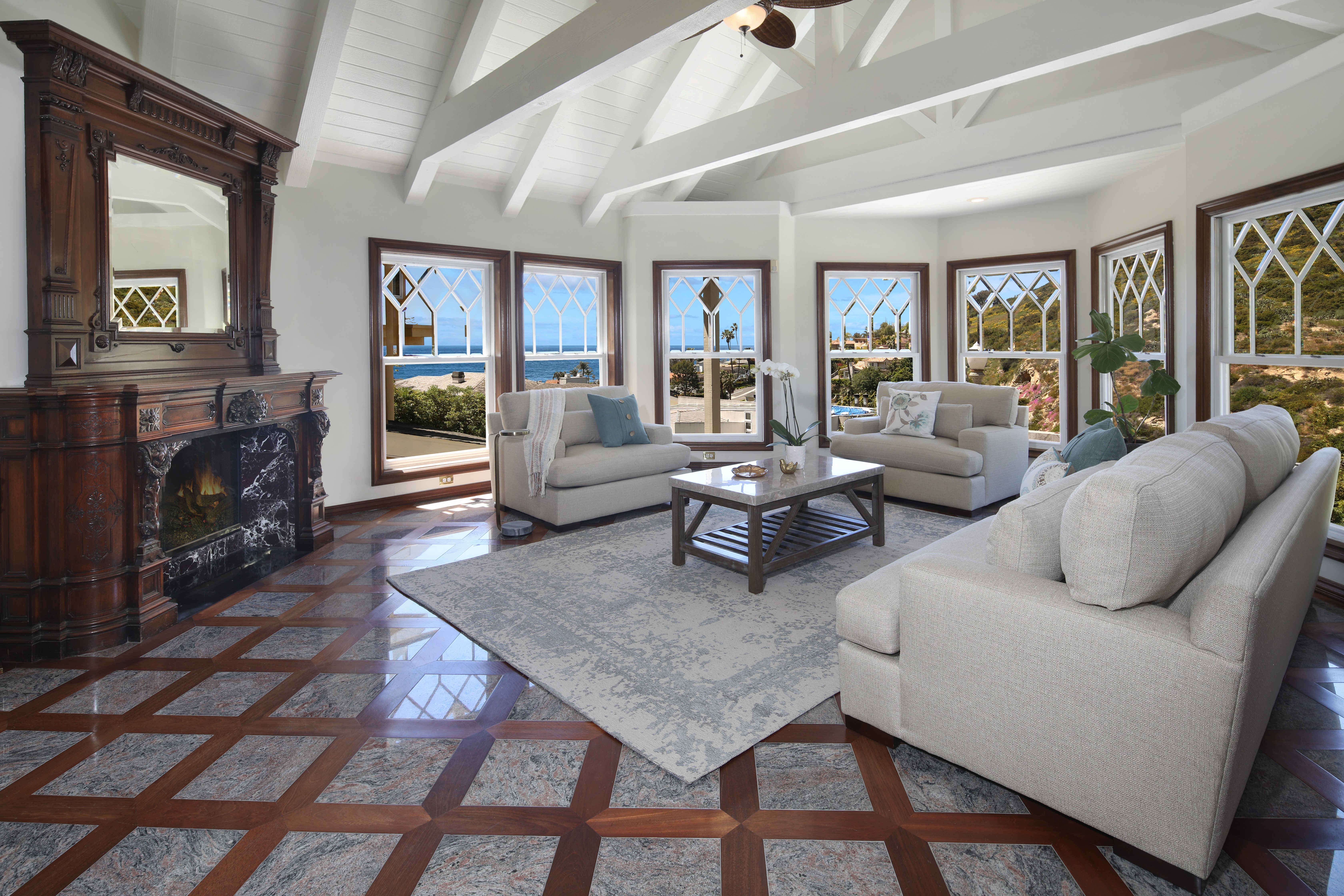 Living room with fireplace and ocean view HD Wallpaper