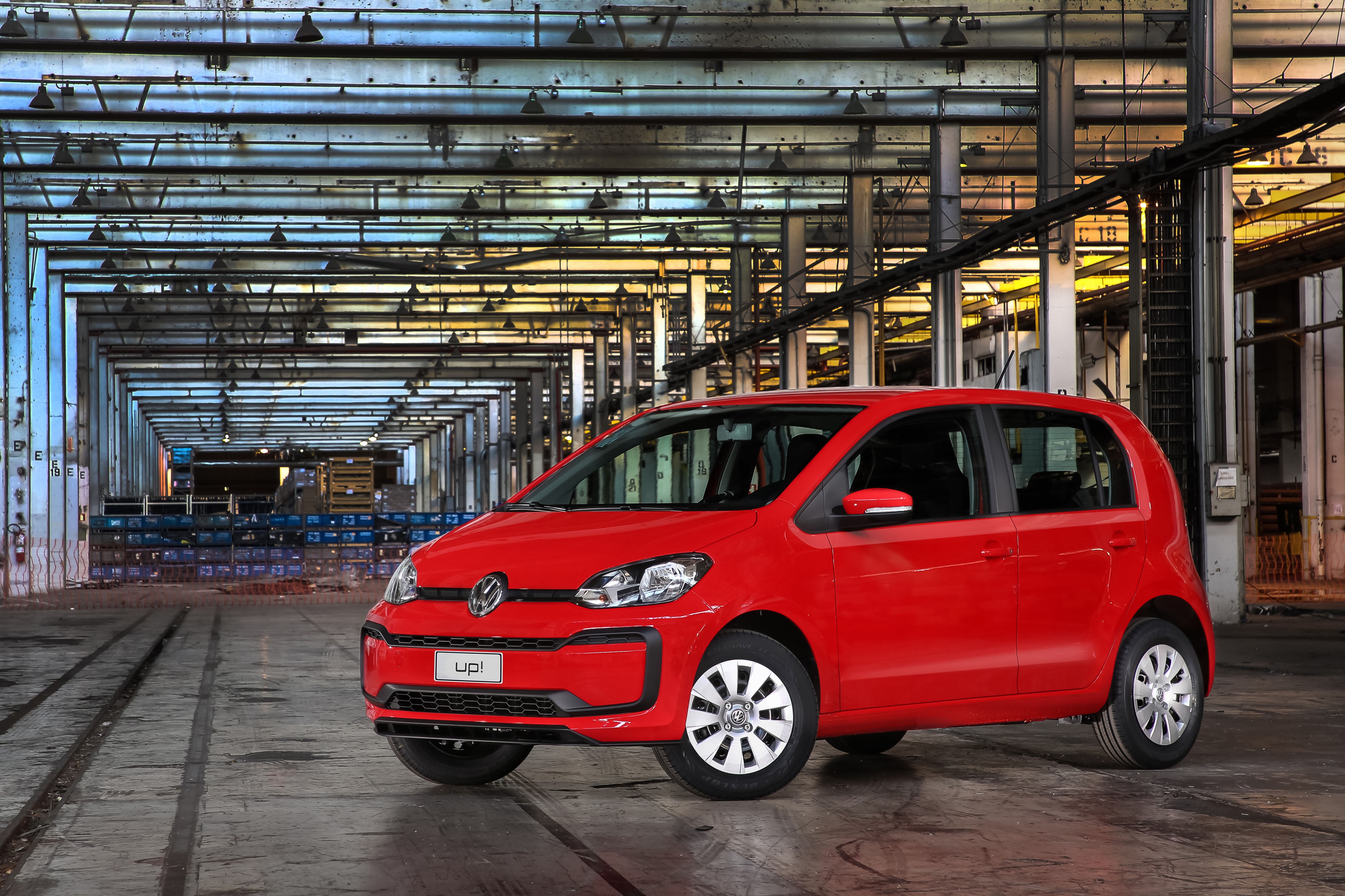 Red Volkswagen Up! in industrial building HD Wallpaper