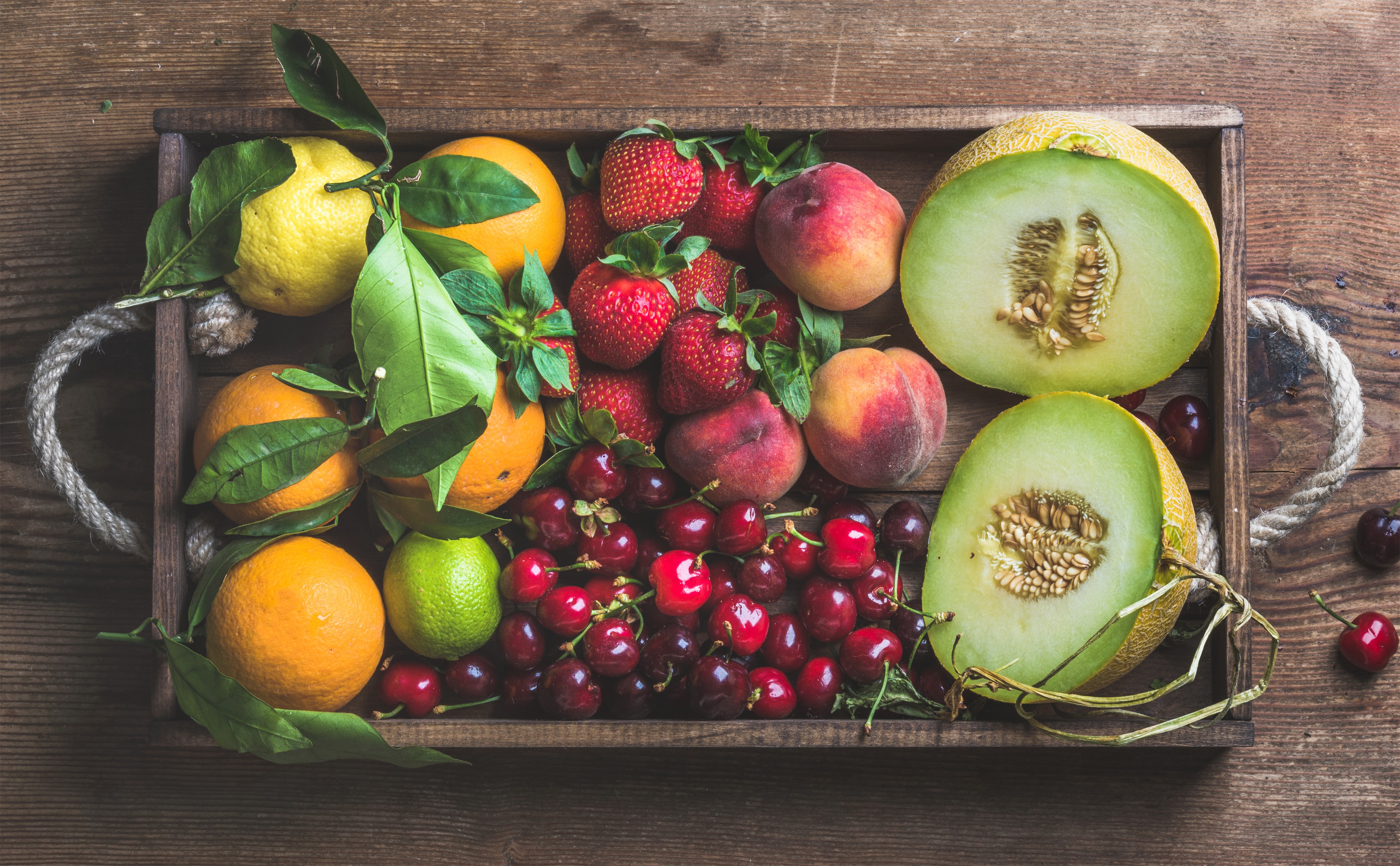 4K Fruit Platter with Melons, Oranges, Cherries, Strawberries, Lemons, and Limes HD Wallpaper