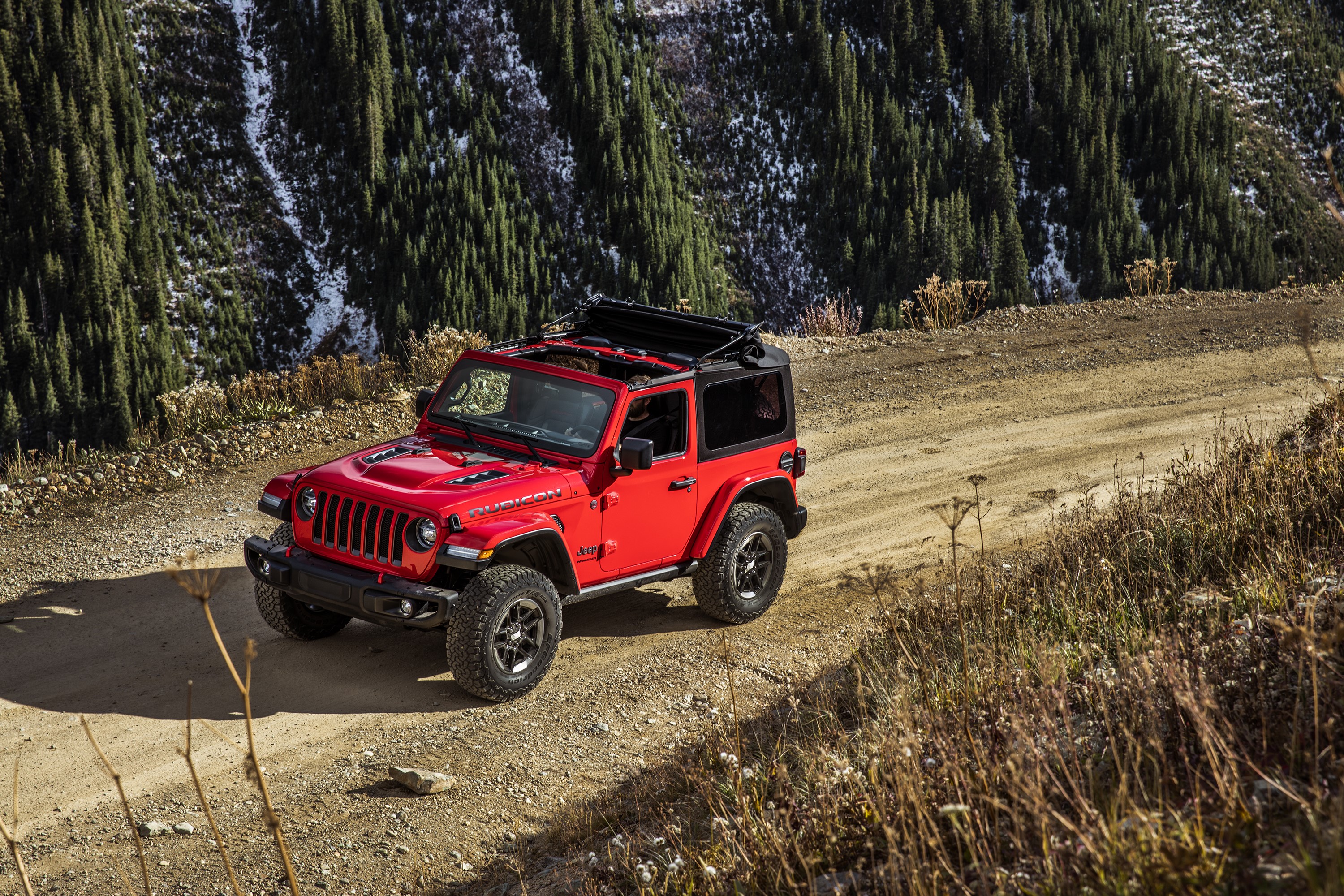 Red Jeep Wrangler Rubicon on a dirt road HD Wallpaper