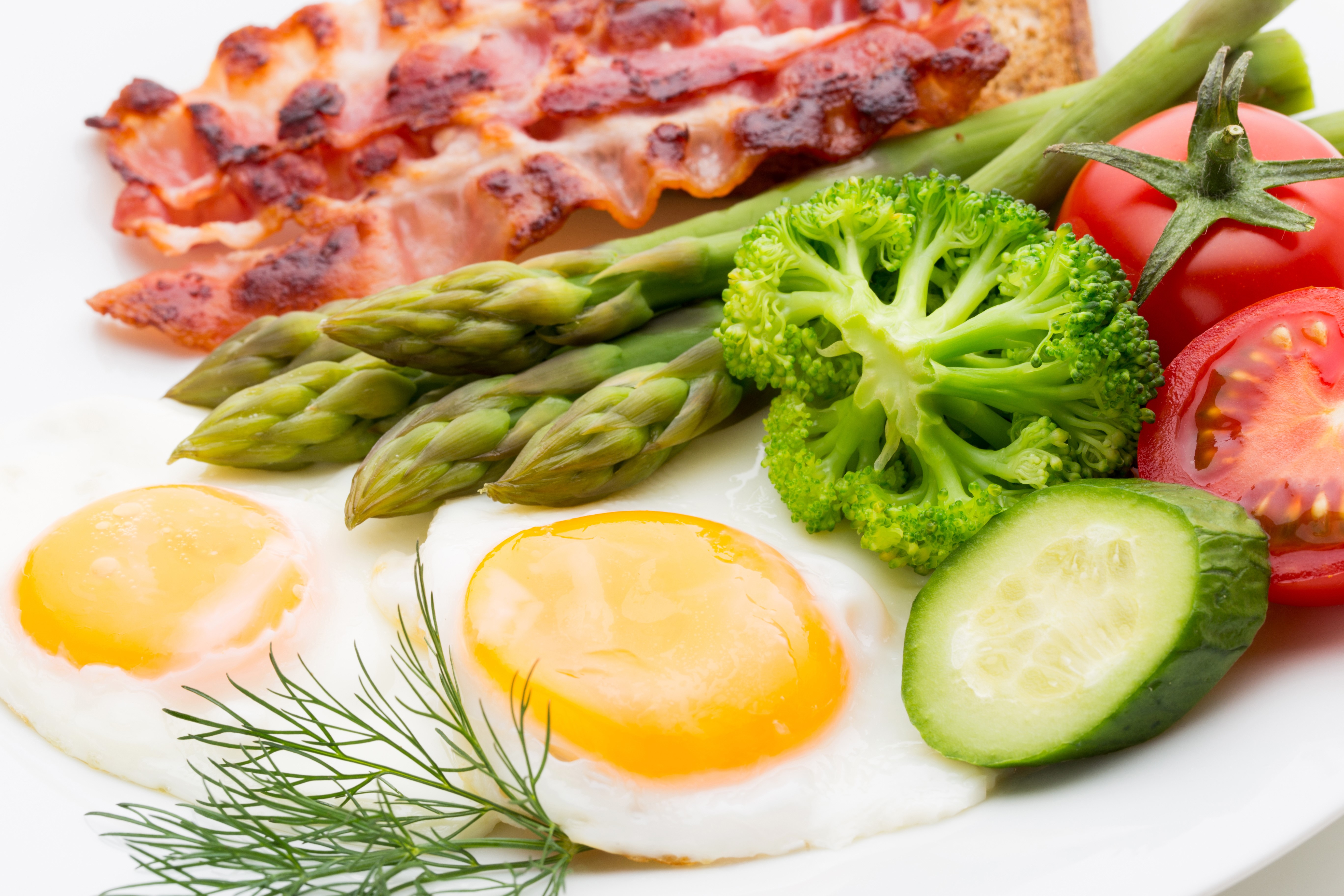 Fried eggs with bacon, asparagus, broccoli, tomato, and cucumber HD Wallpaper
