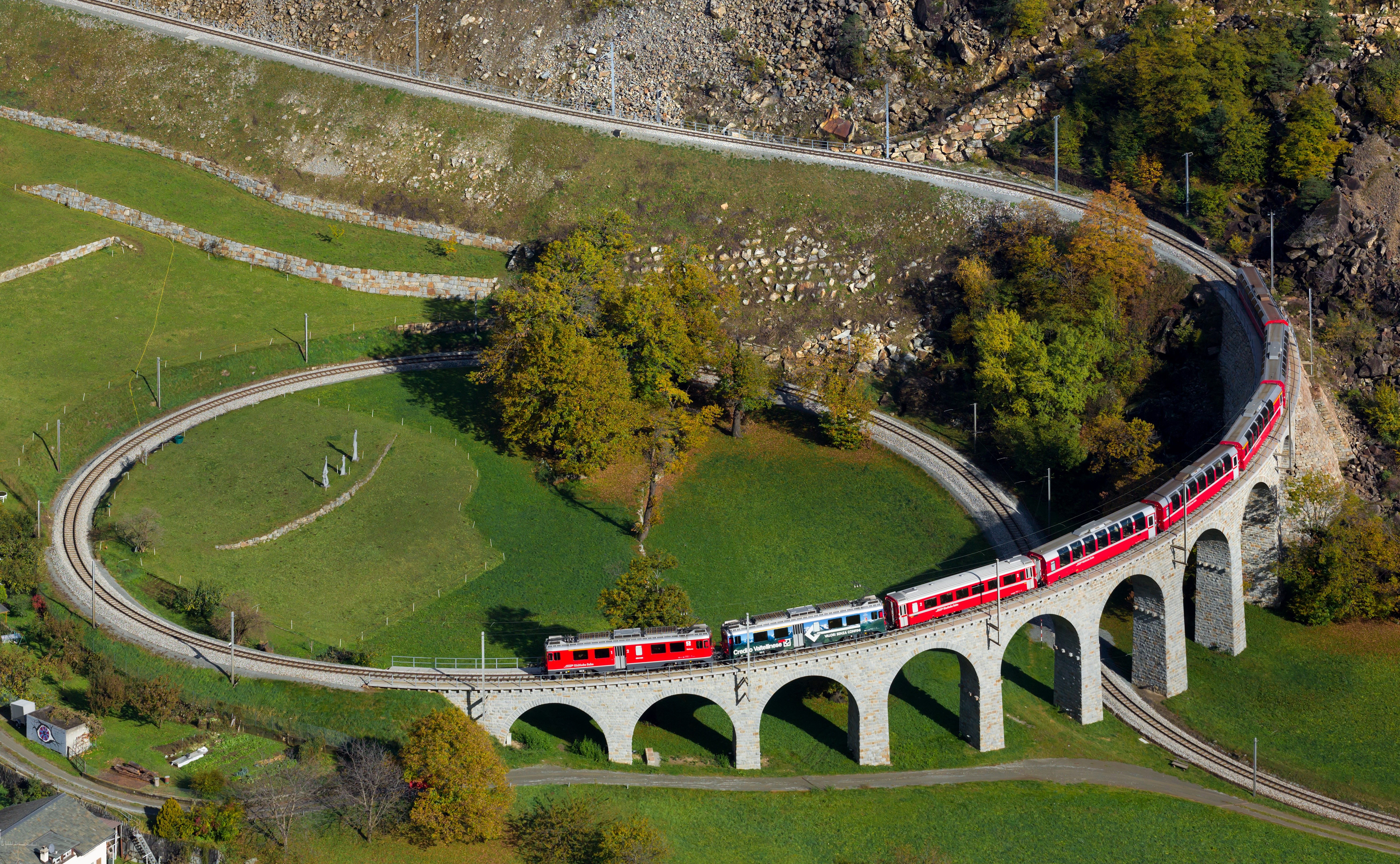 Brusio spiral viaduct with trains in Switzerland HD Wallpaper