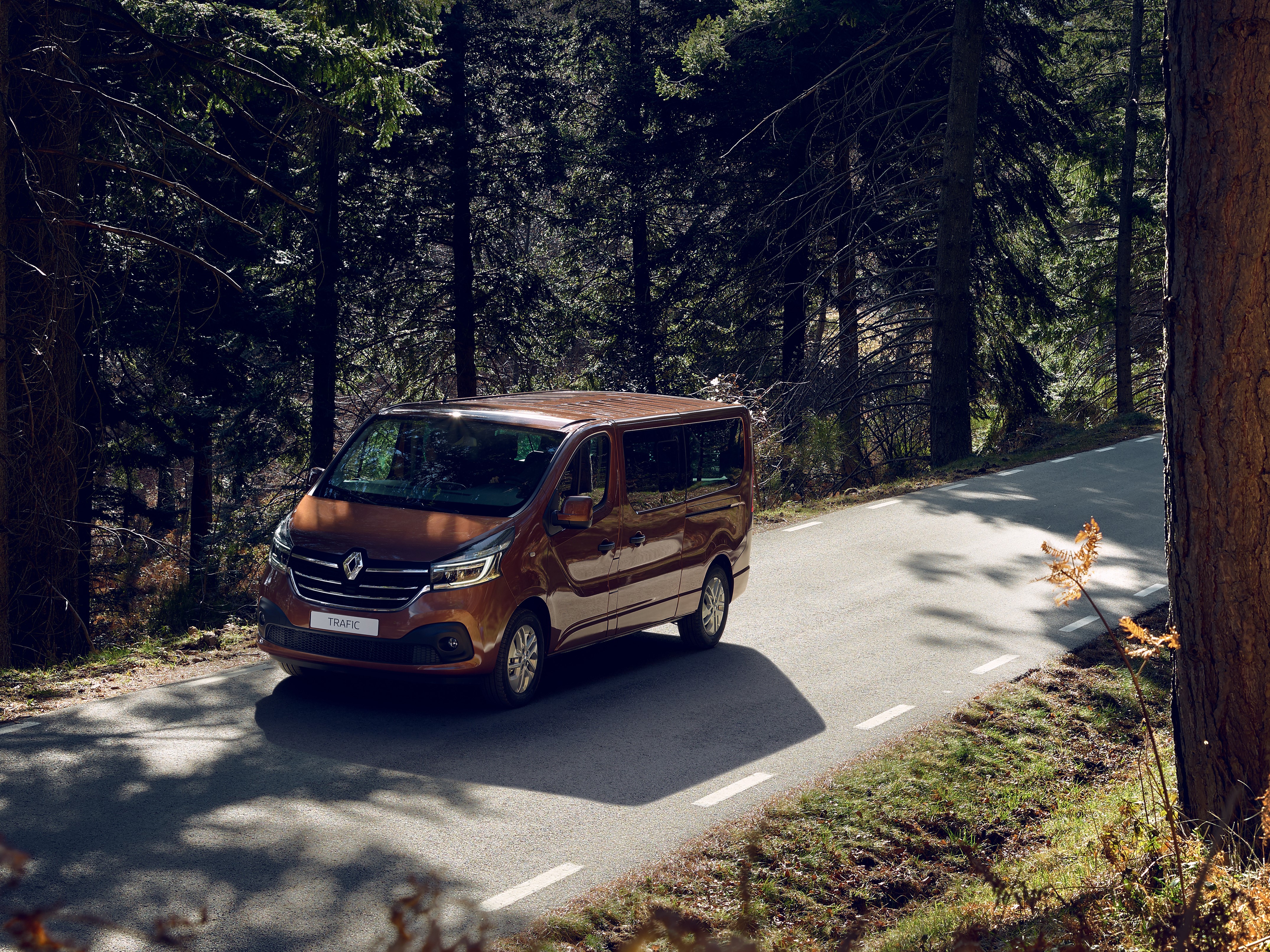 Renault Trafic Minibus driving on a forest road HD Wallpaper
