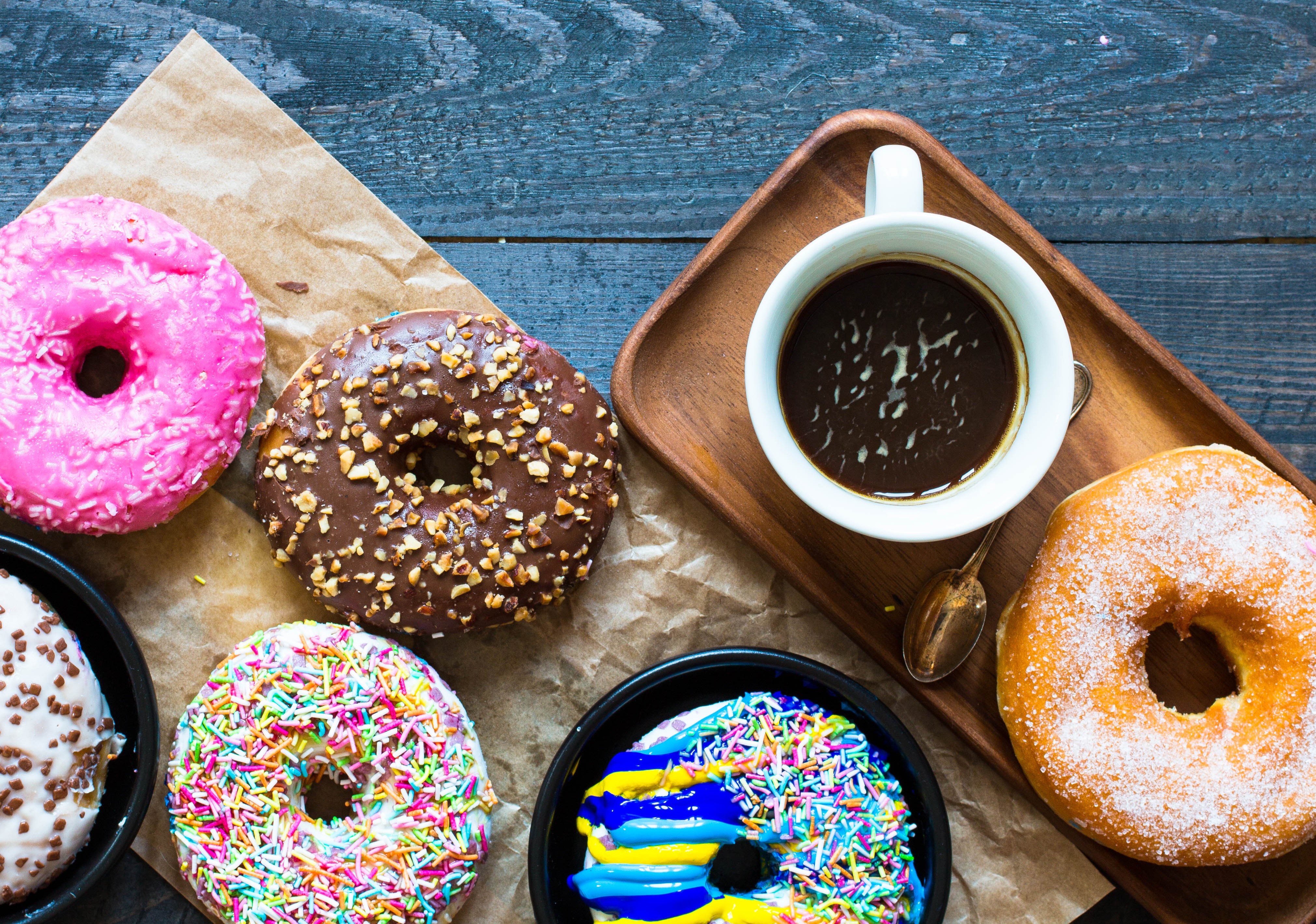 Donuts and Coffee on Wood Planks HD Wallpaper