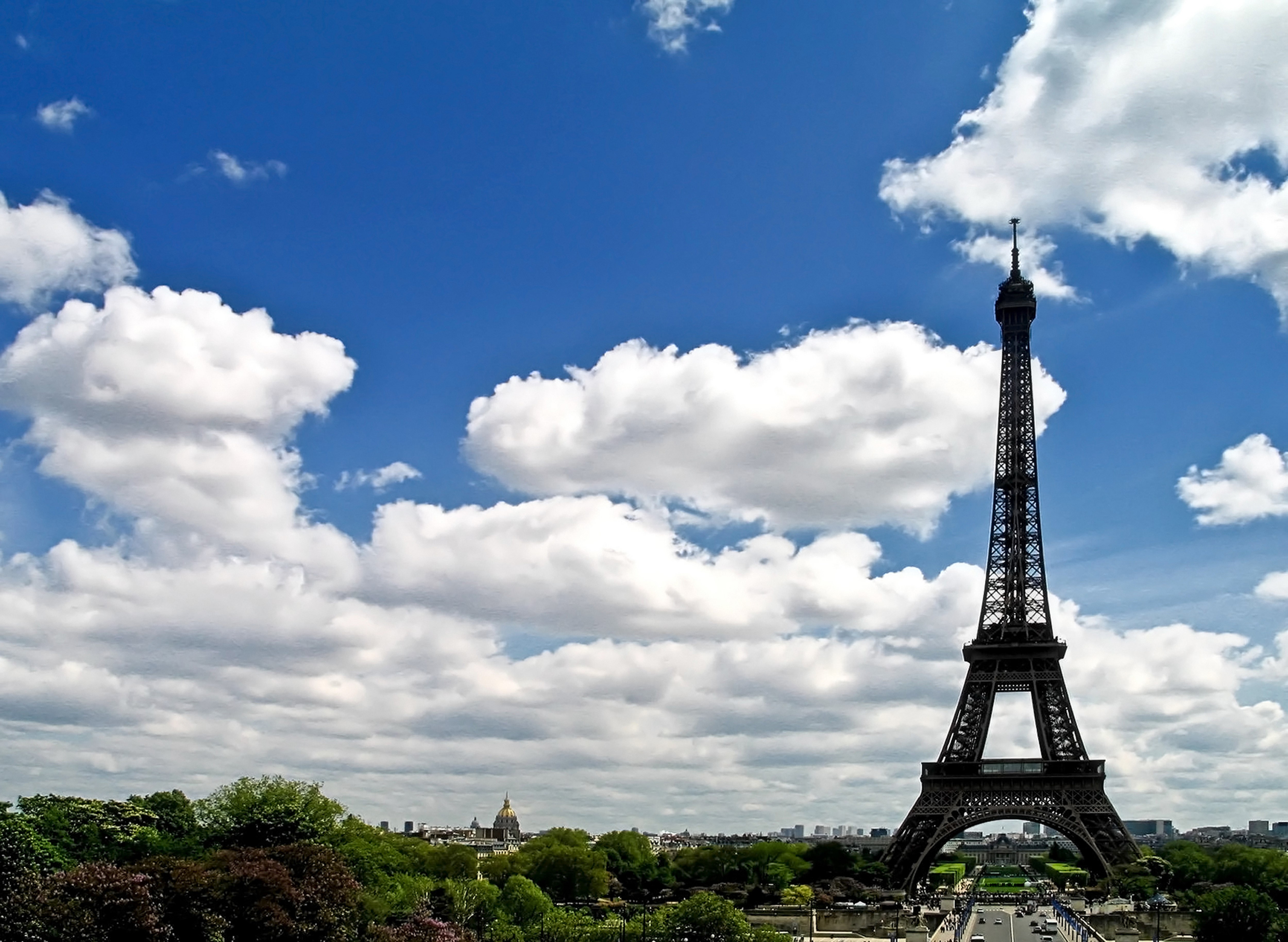 Eiffel Tower in Paris under a cloudy sky HD Wallpaper