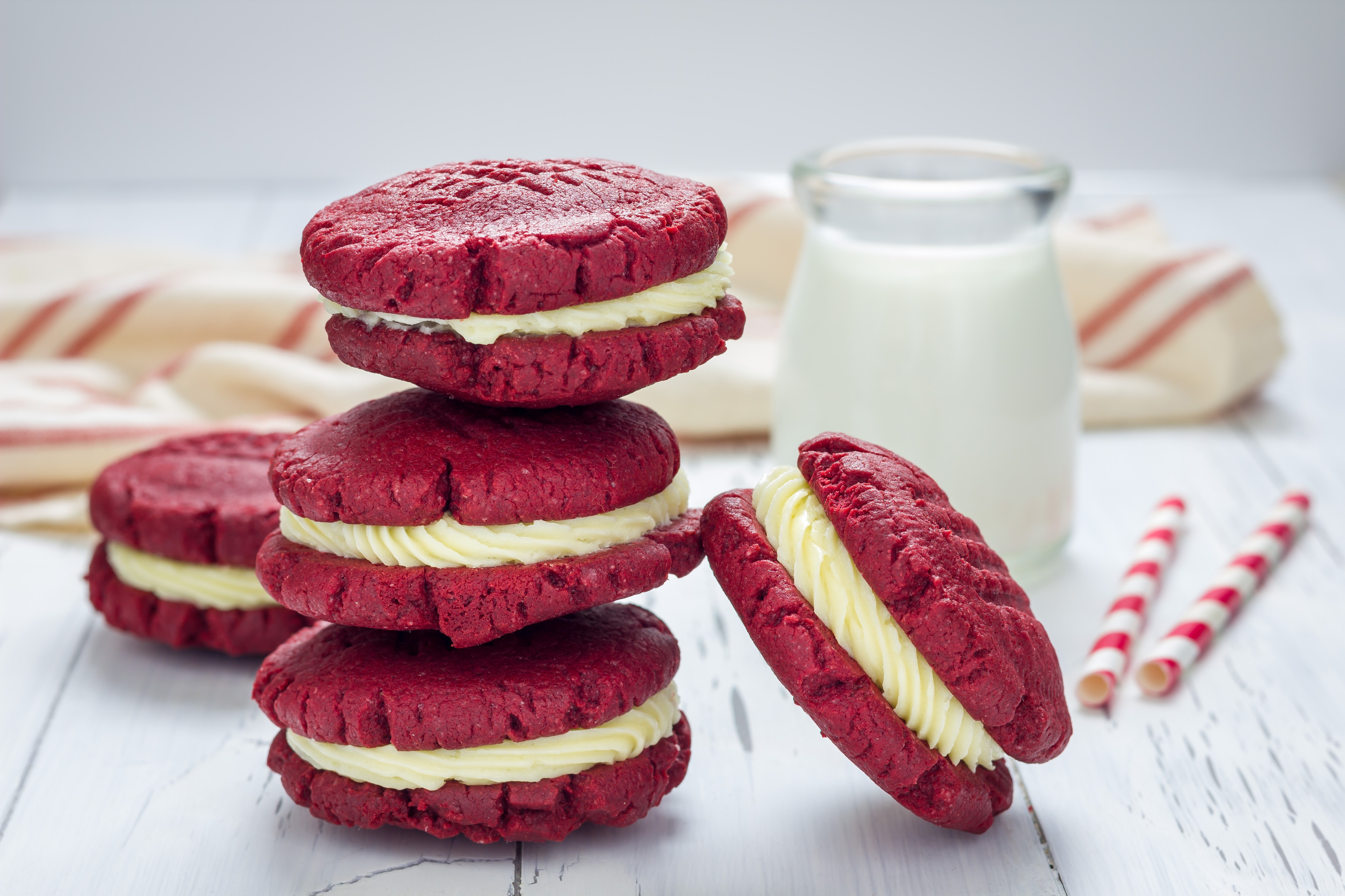 Red velvet cookies with cream filling and milk HD Wallpaper