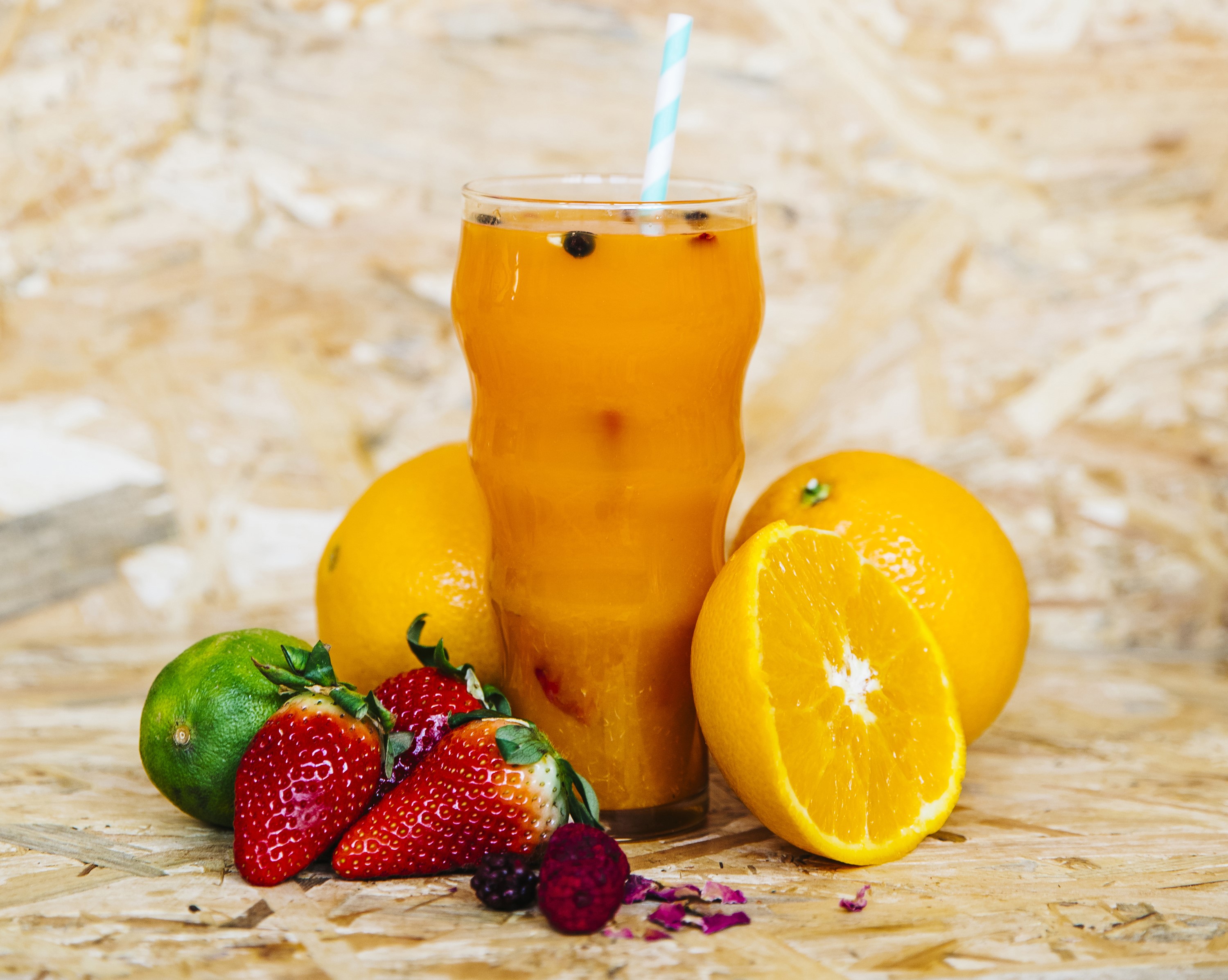 Orange juice with fruits in a glass HD Wallpaper