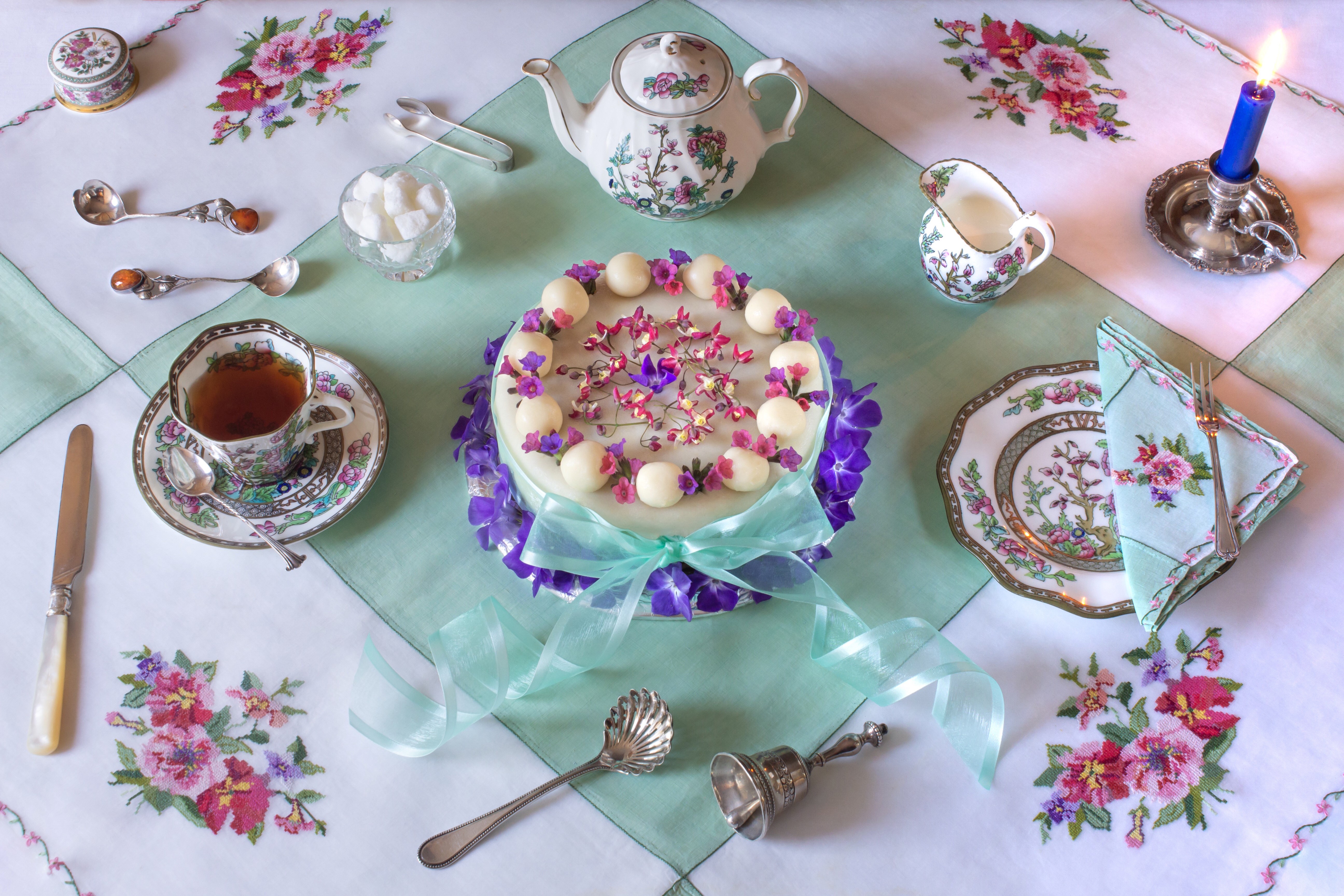 Tea set with cake, kettle, and candle HD Wallpaper