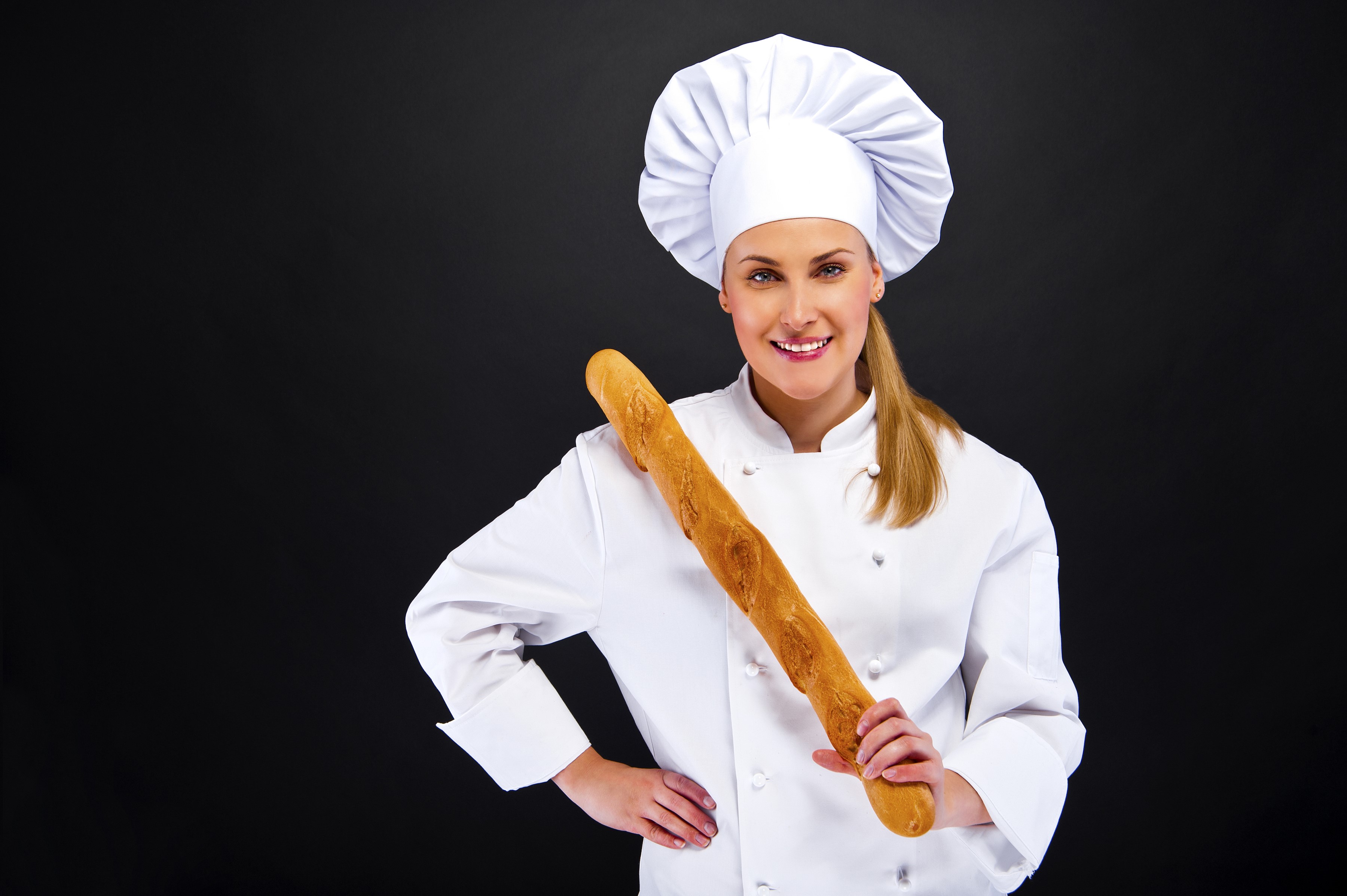 Baker holding a baguette in a chef's uniform HD Wallpaper